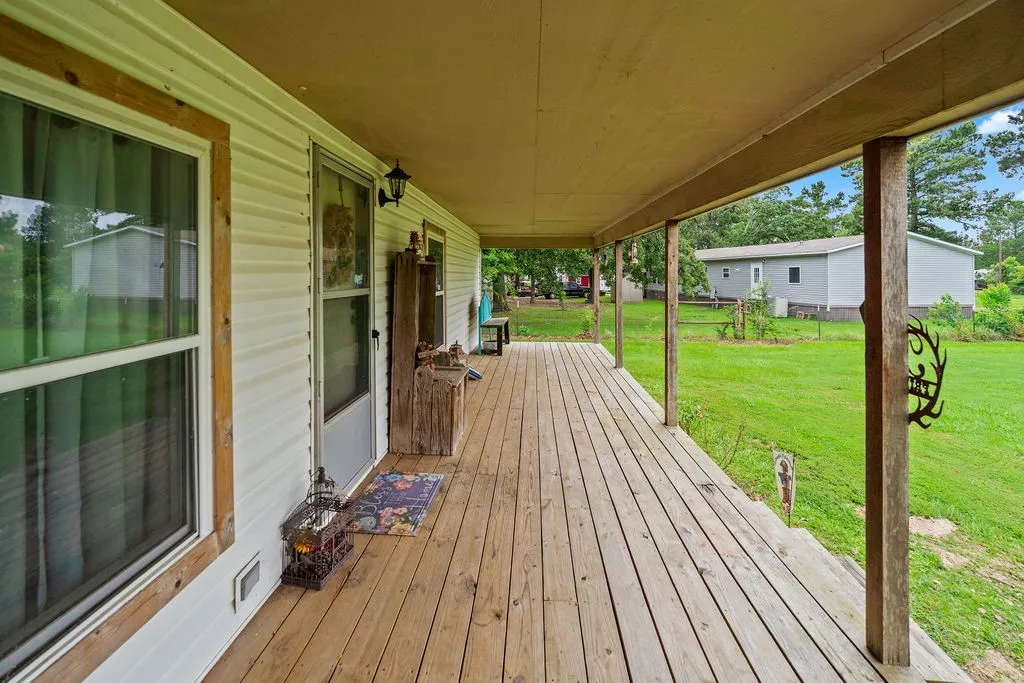 Huge front porch is the perfect place for morning coffee overlooking your expansive front yard.