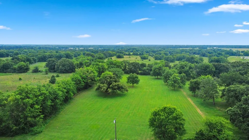 2 additional acres are available for sale for a total of approx 2.75 AC; level with gorgeous shade trees and cleared pasture