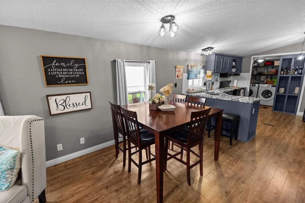 Kitchen has breakfast bar for easier school mornings and snacks