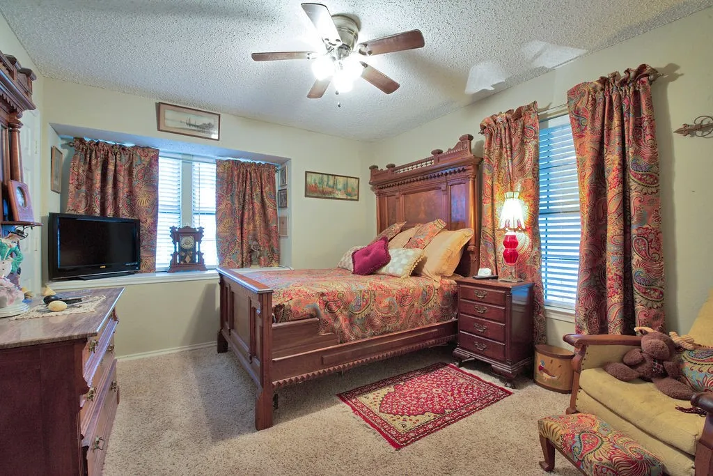 Bedroom featuring carpet flooring and light-toned wall paint