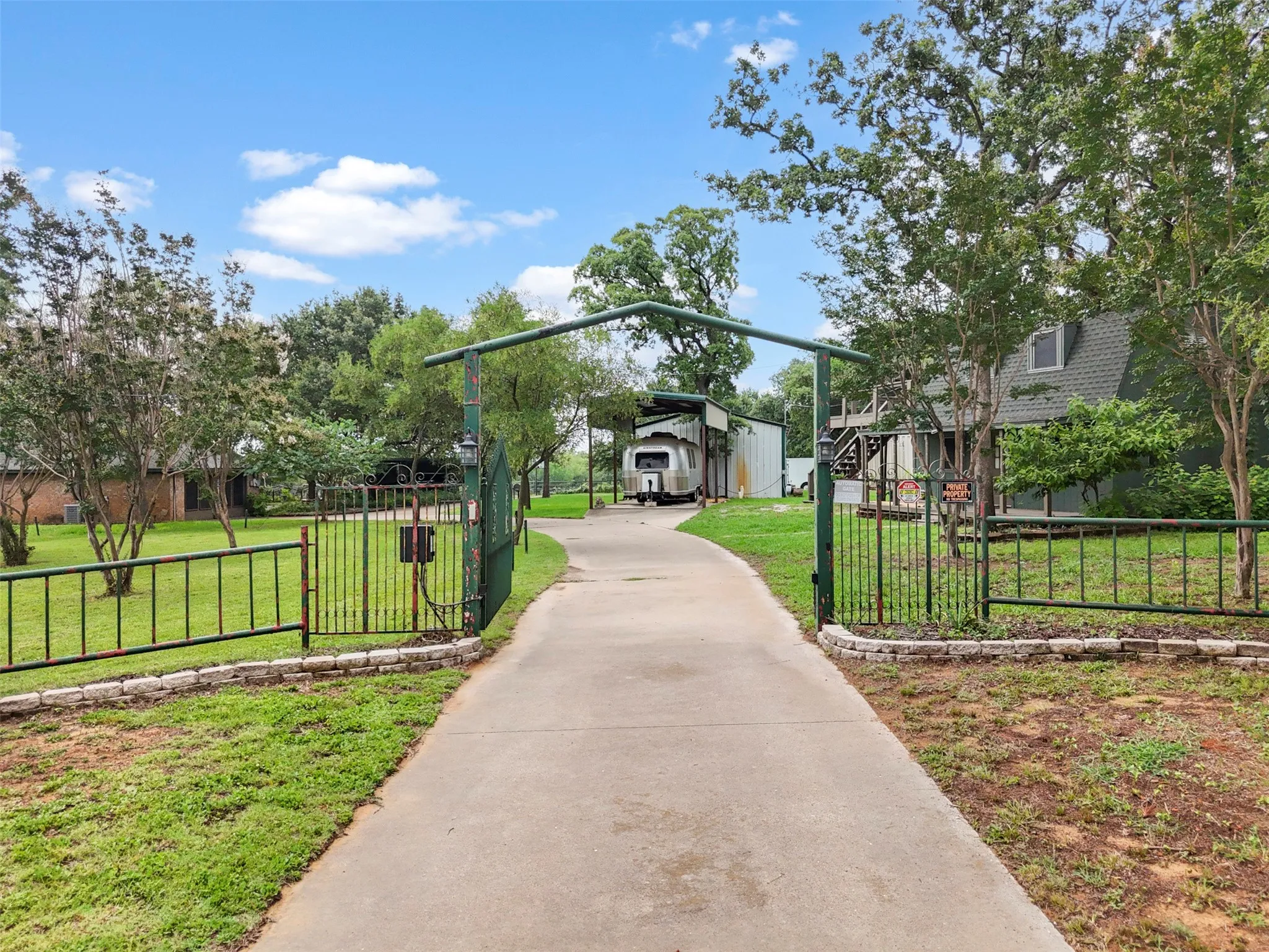 Ryan Avenue entrance to property.  There are two street, Electric Gated entrances.