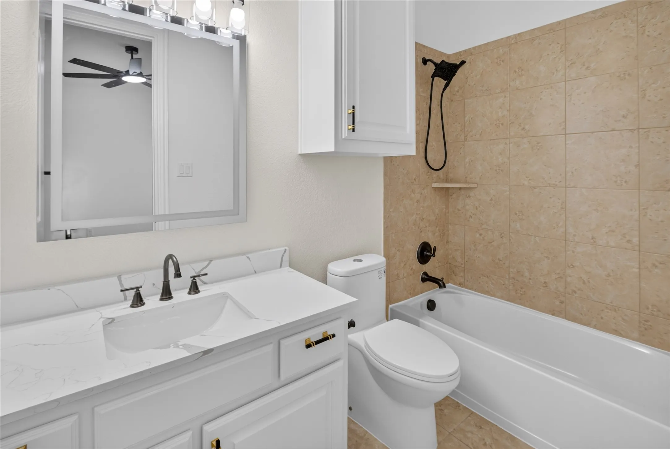 Bathroom featuring a white vanity with a rectangular undermount sink, a white countertop, and oil-rubbed bronze fixtures