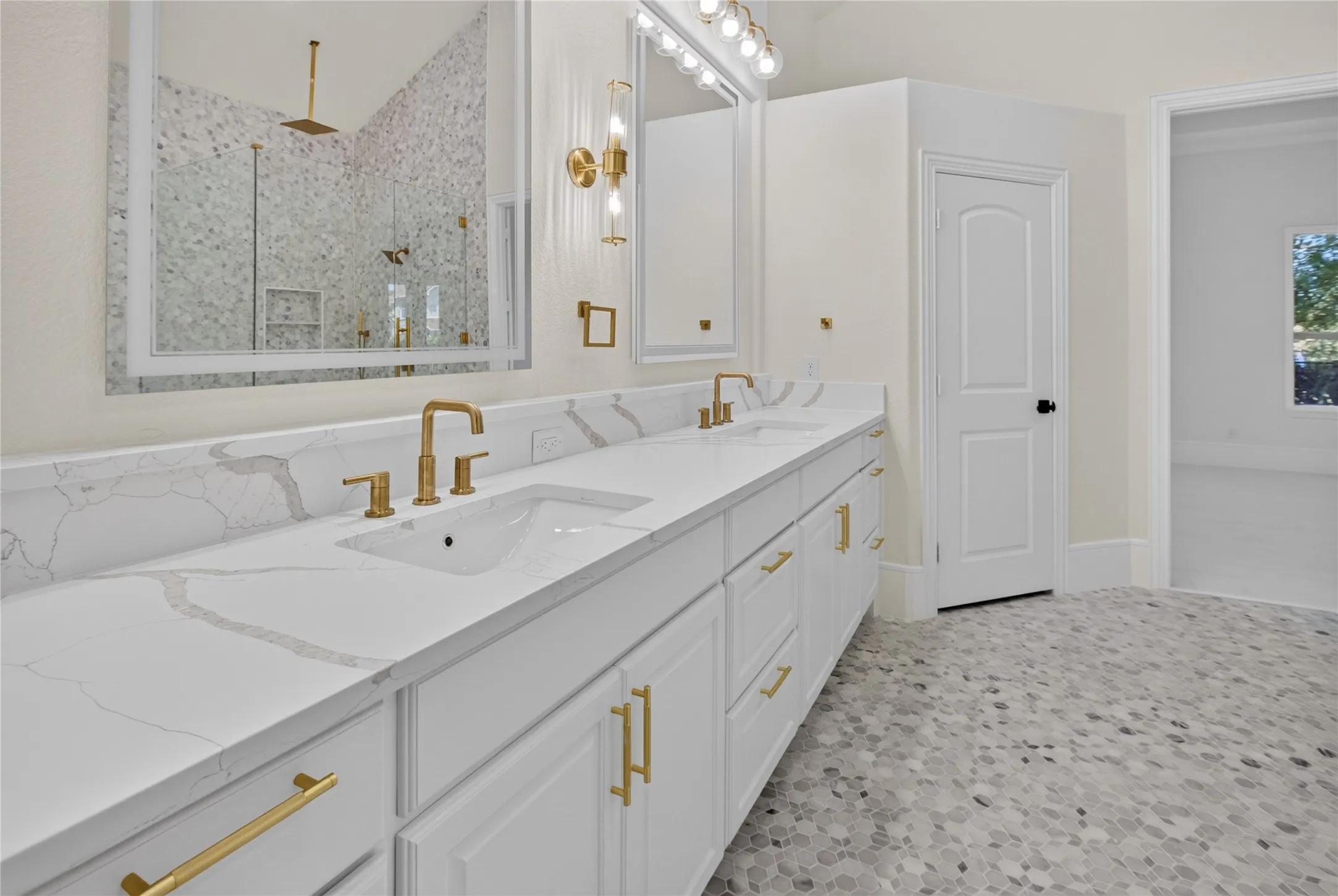 Dual vanity featuring quartz countertops and under-mount sinks