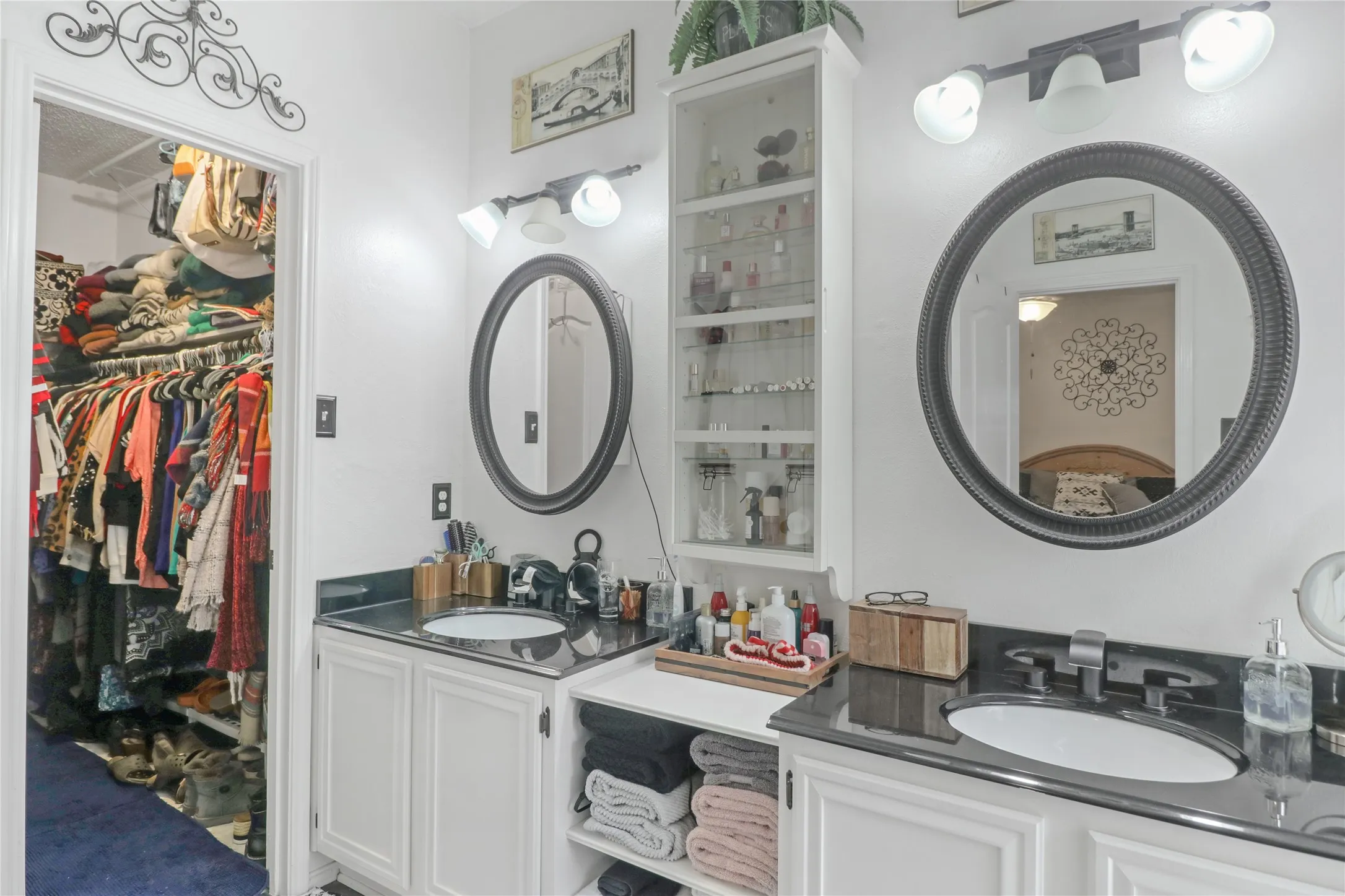Dual vanities and walk in closet in master bath.