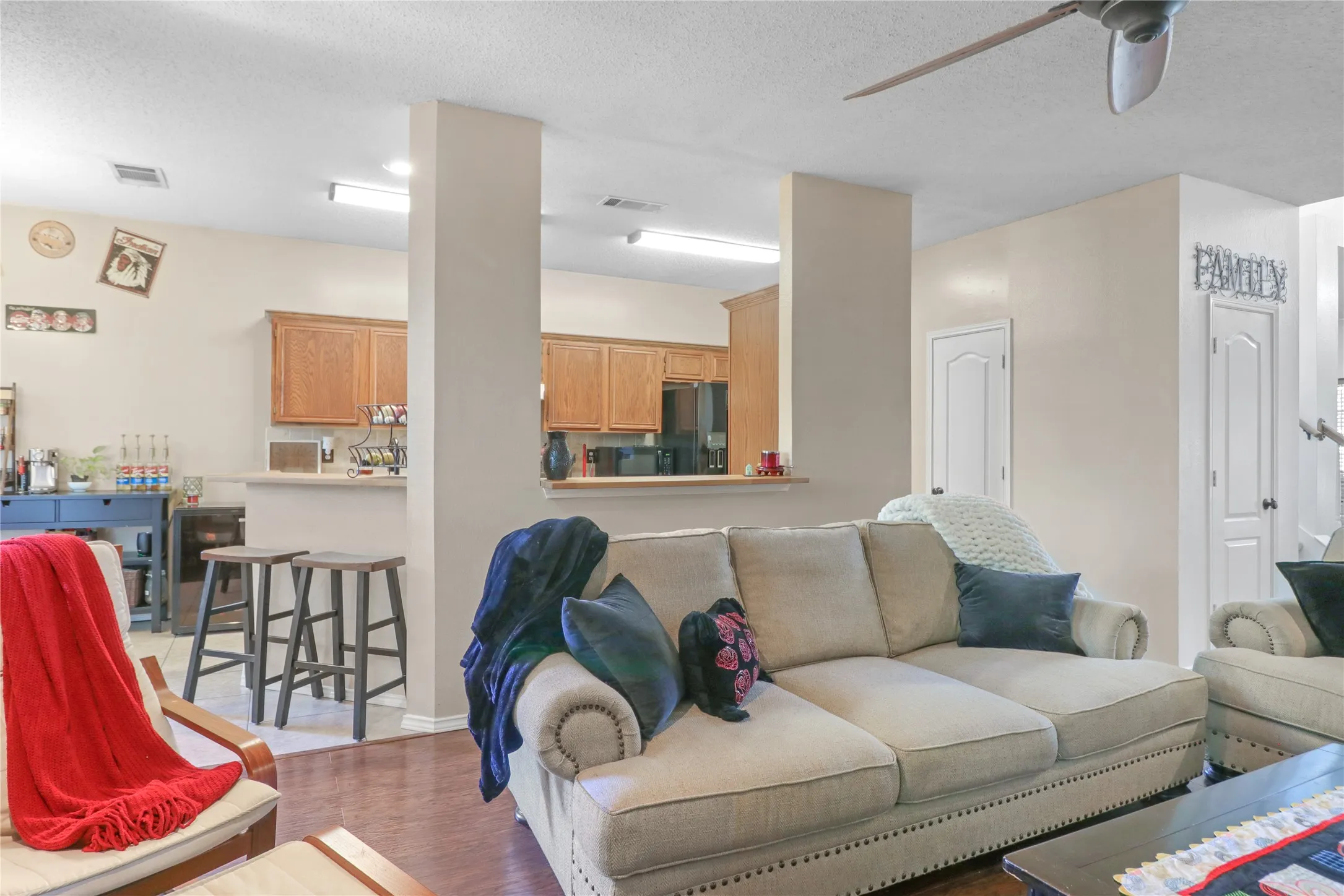 View of living room and kitchen.