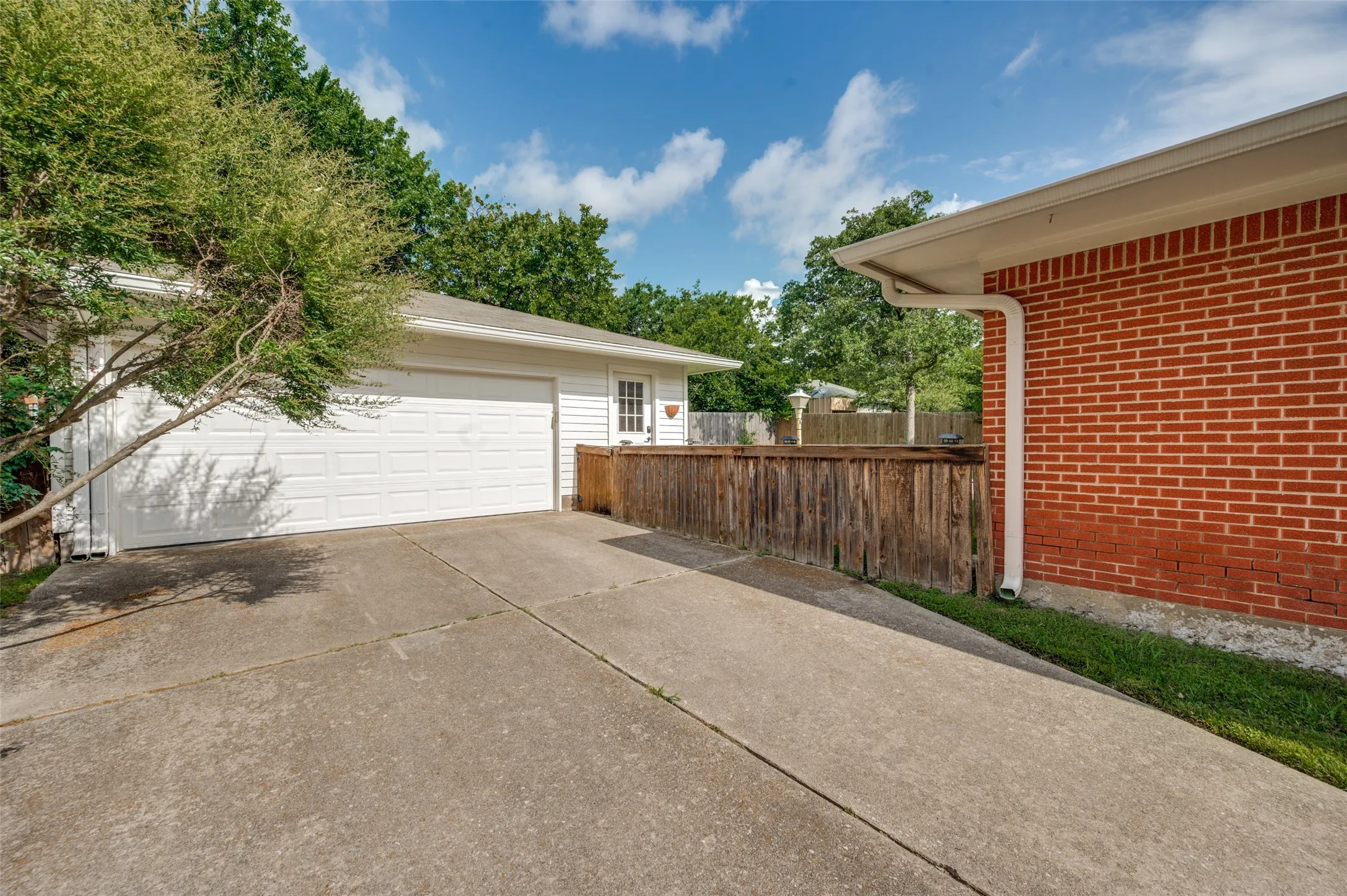 The detached garage has room to park two vehicles and includes a workshop/laundry area.