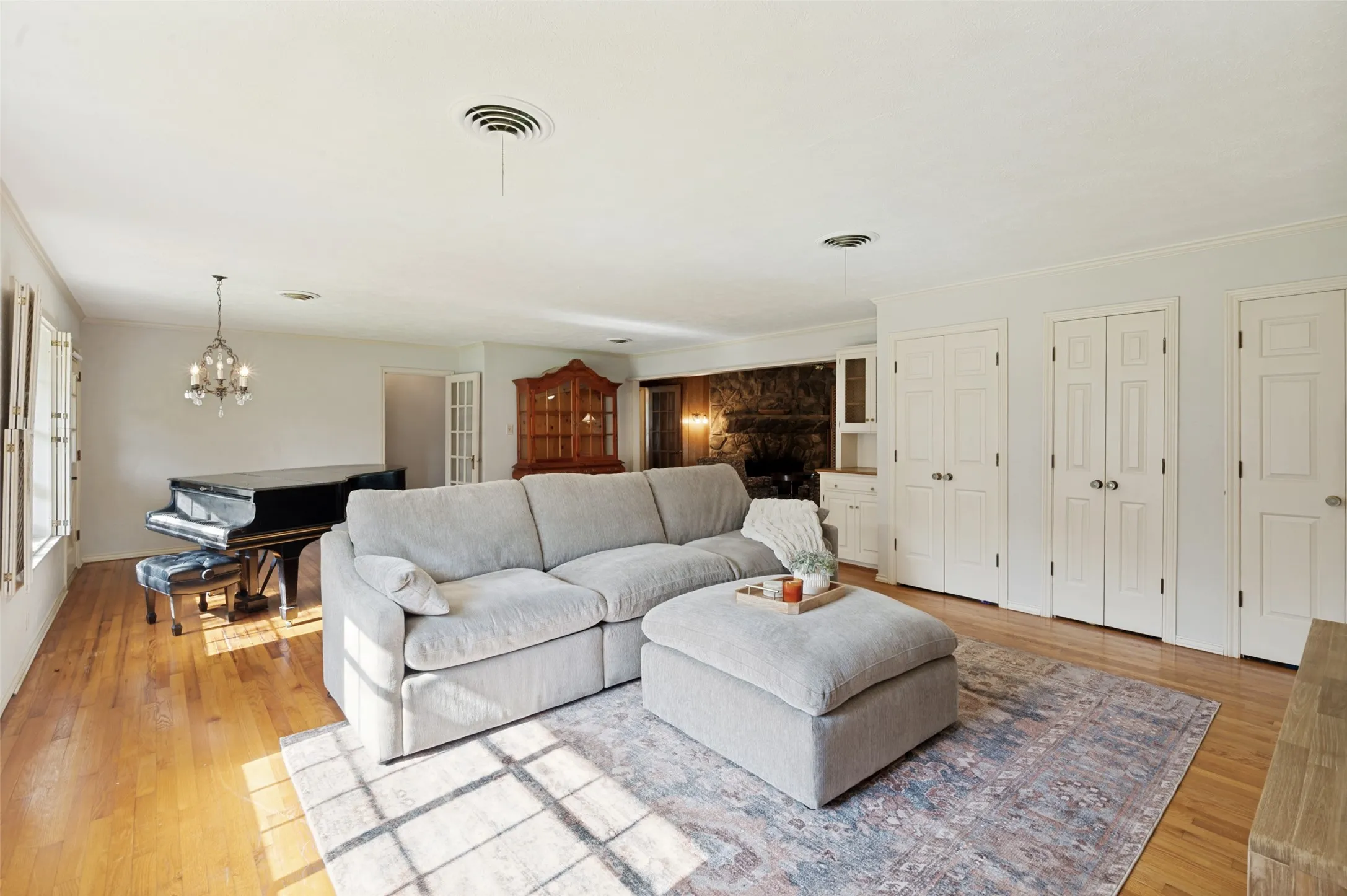 The living room offers a view of the stone fireplace in the back of the home.