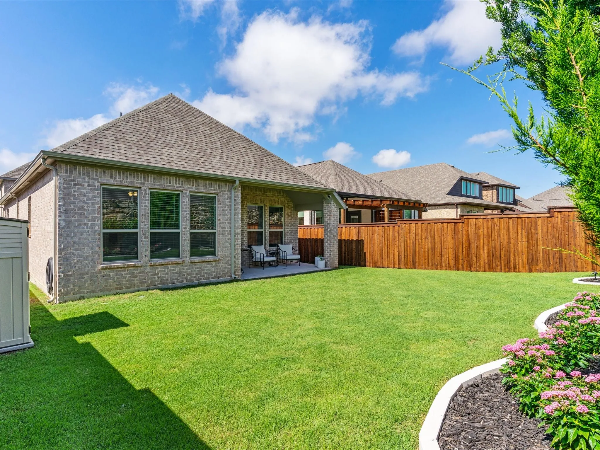 Fenced backyard with room for recreation, pets, or gardening.