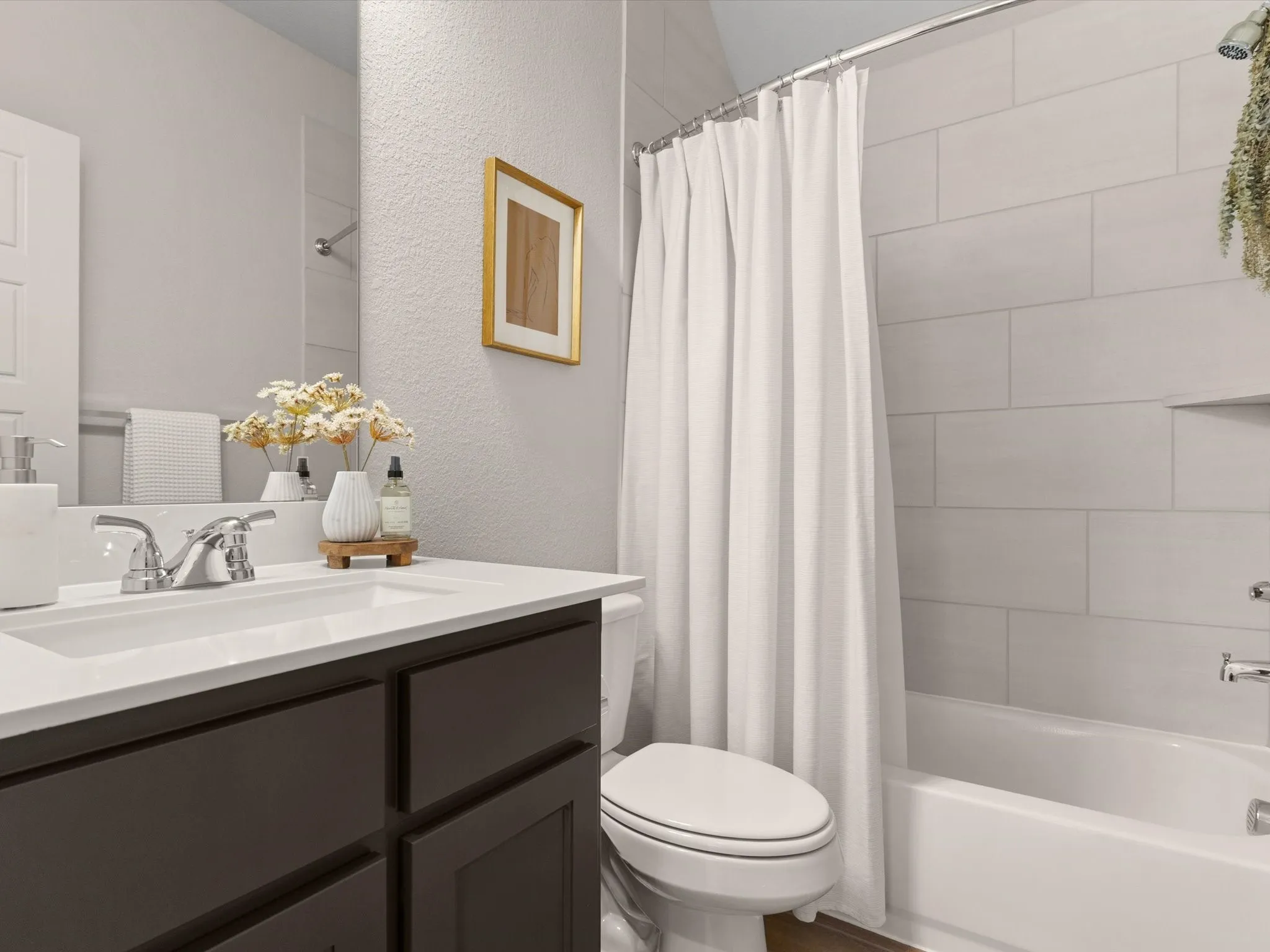Full secondary bathroom with modern fixtures and finishes.