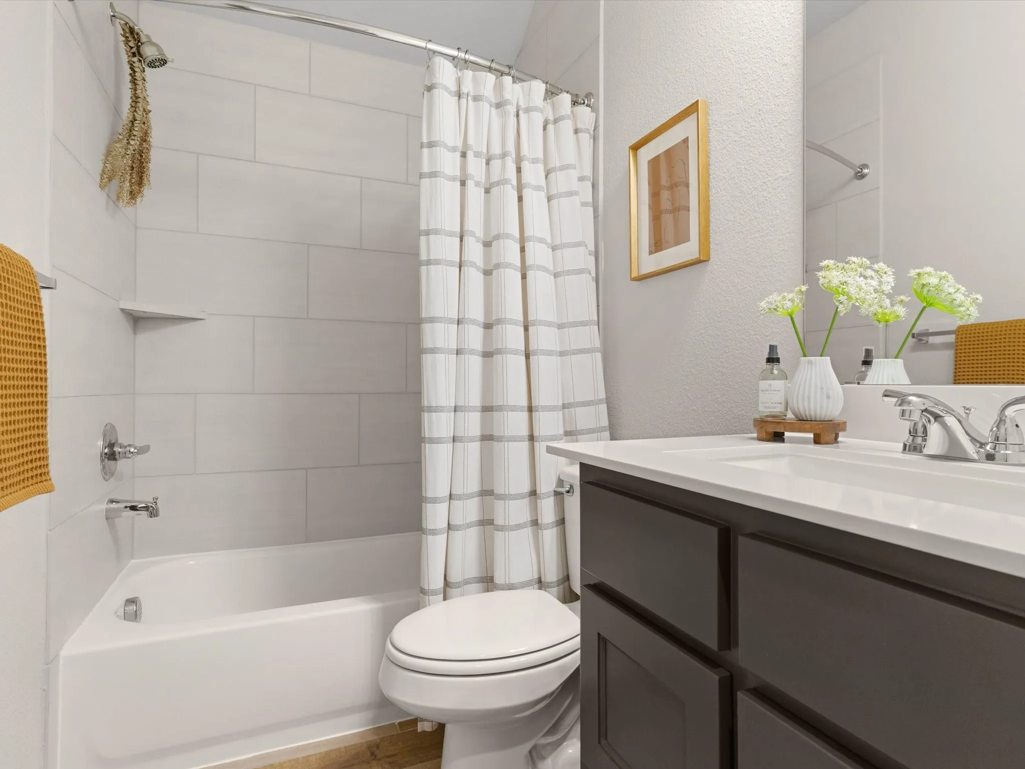 Full secondary bathroom with modern fixtures and finishes.