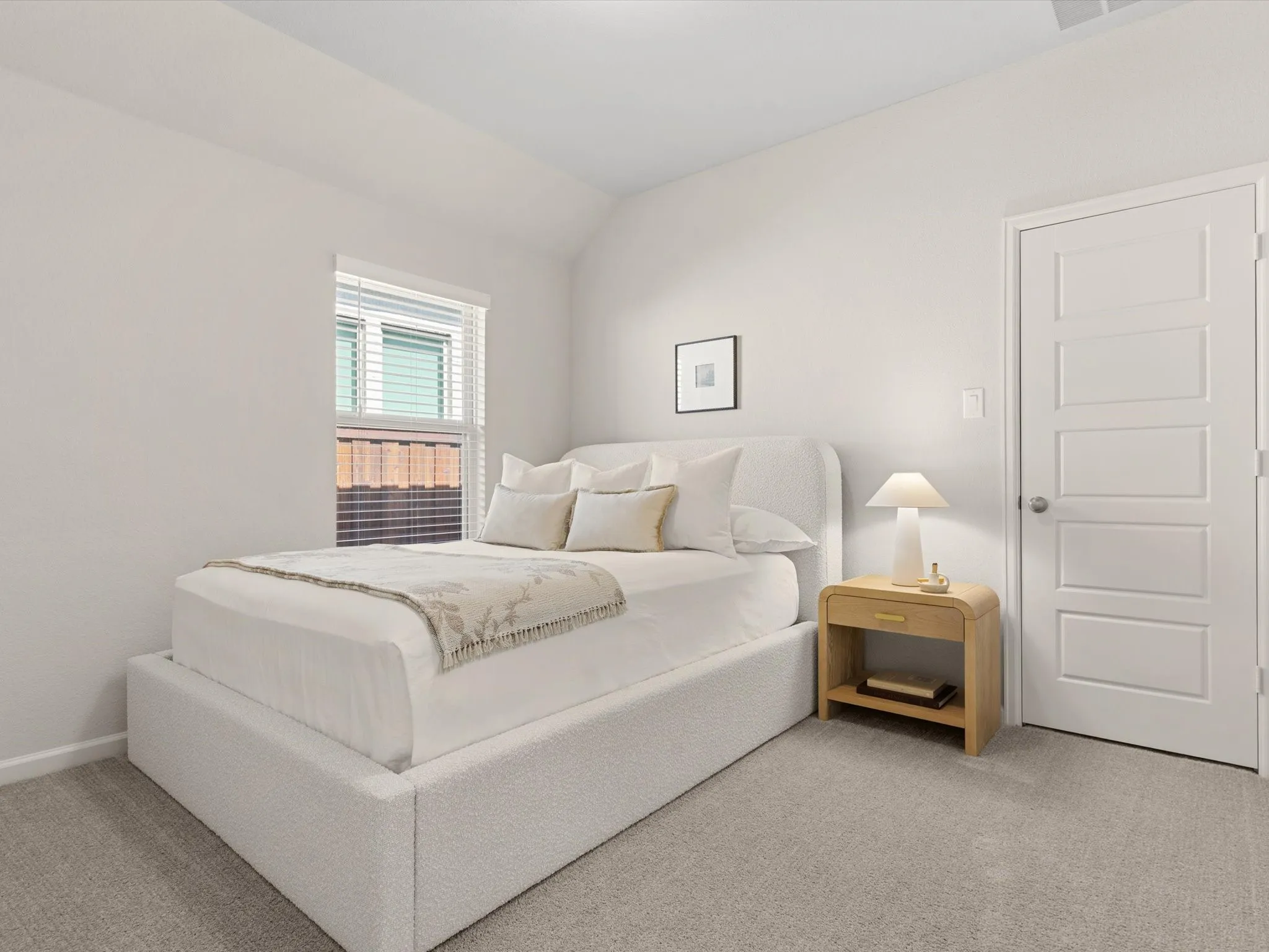 Secondary bedroom suitable for guests, family members, or a home office.