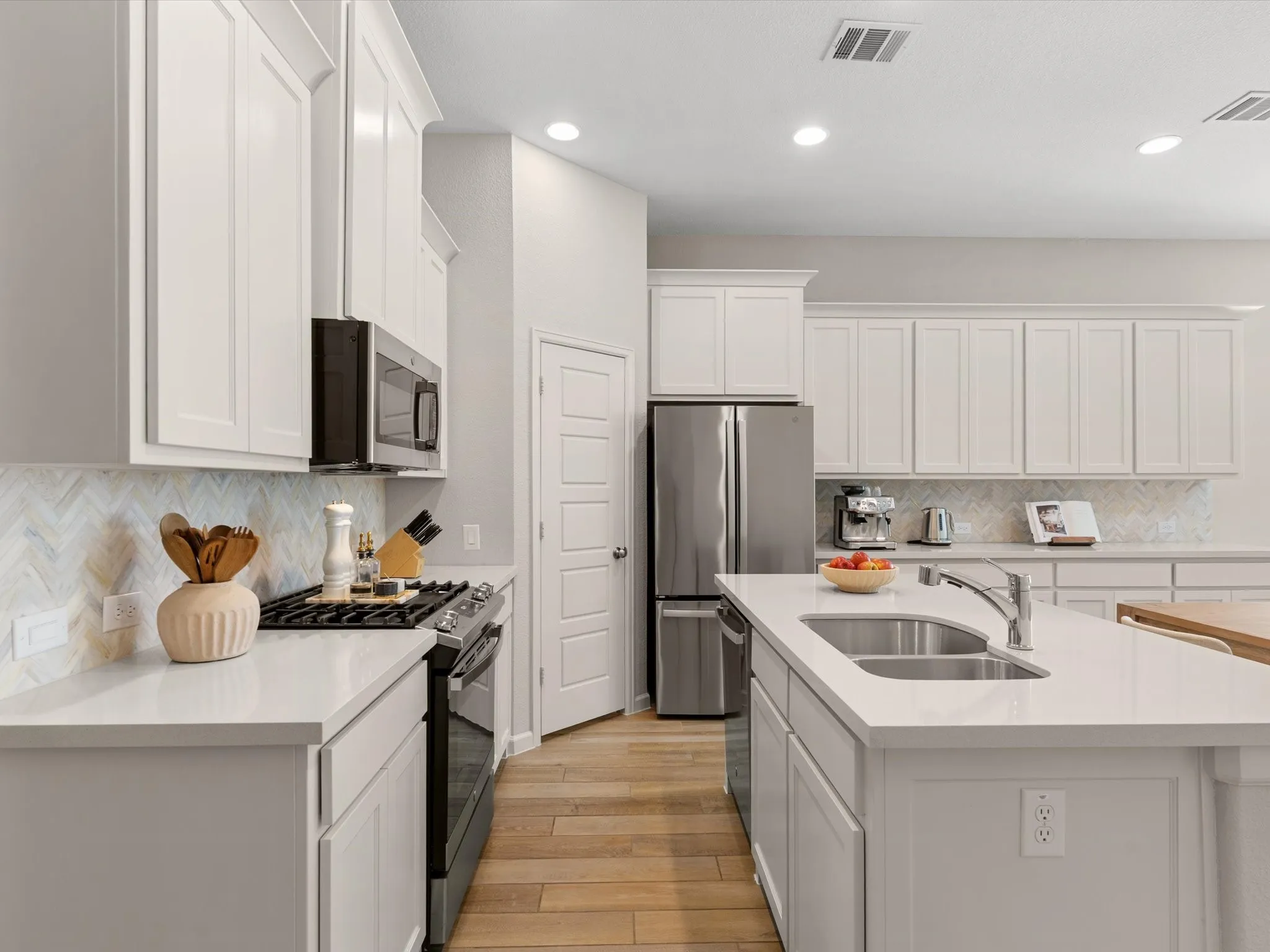 Kitchen with generous workspace, storage, and seamless flow to the main living areas.