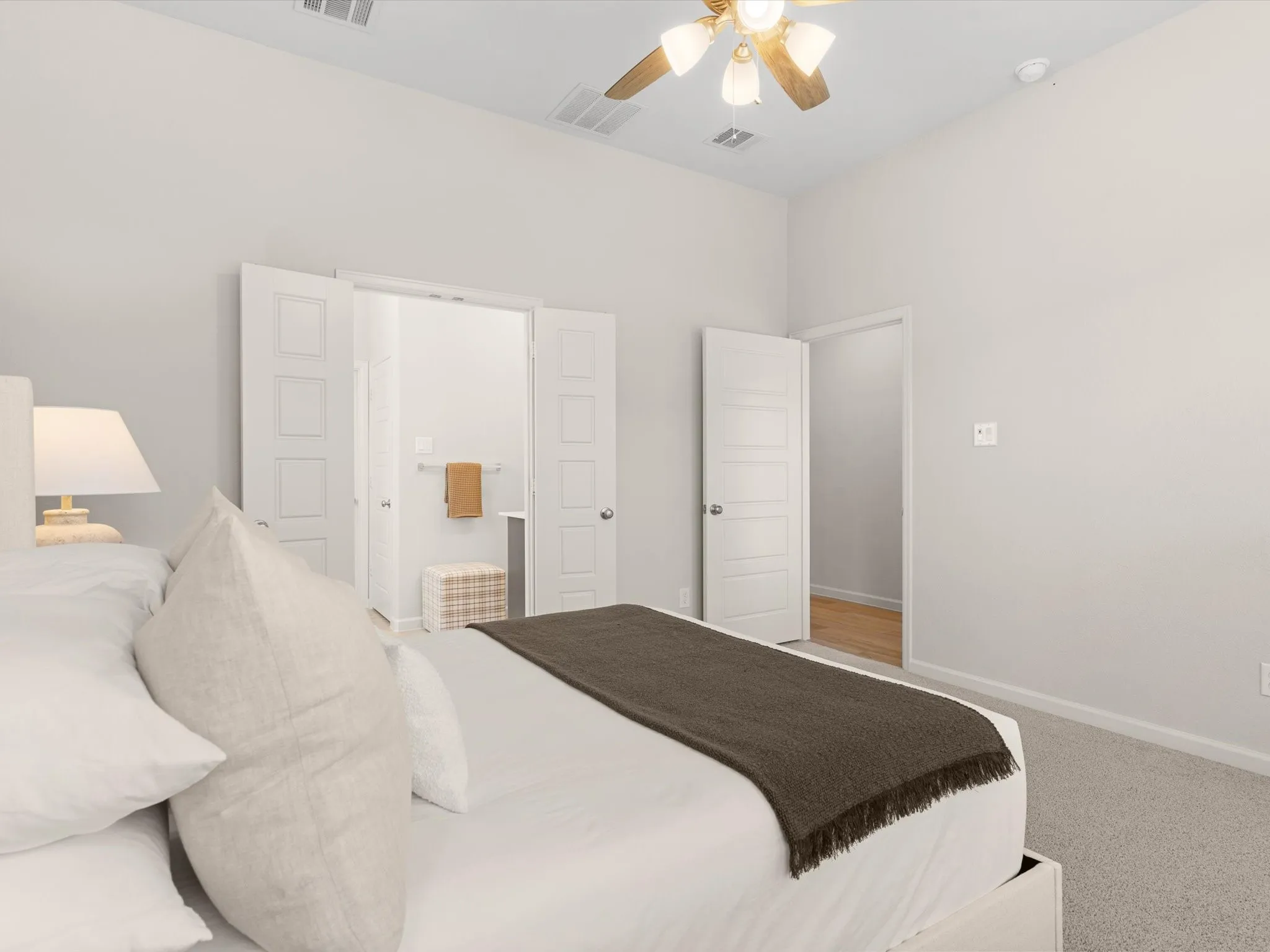 Private primary suite with spacious layout and large windows.