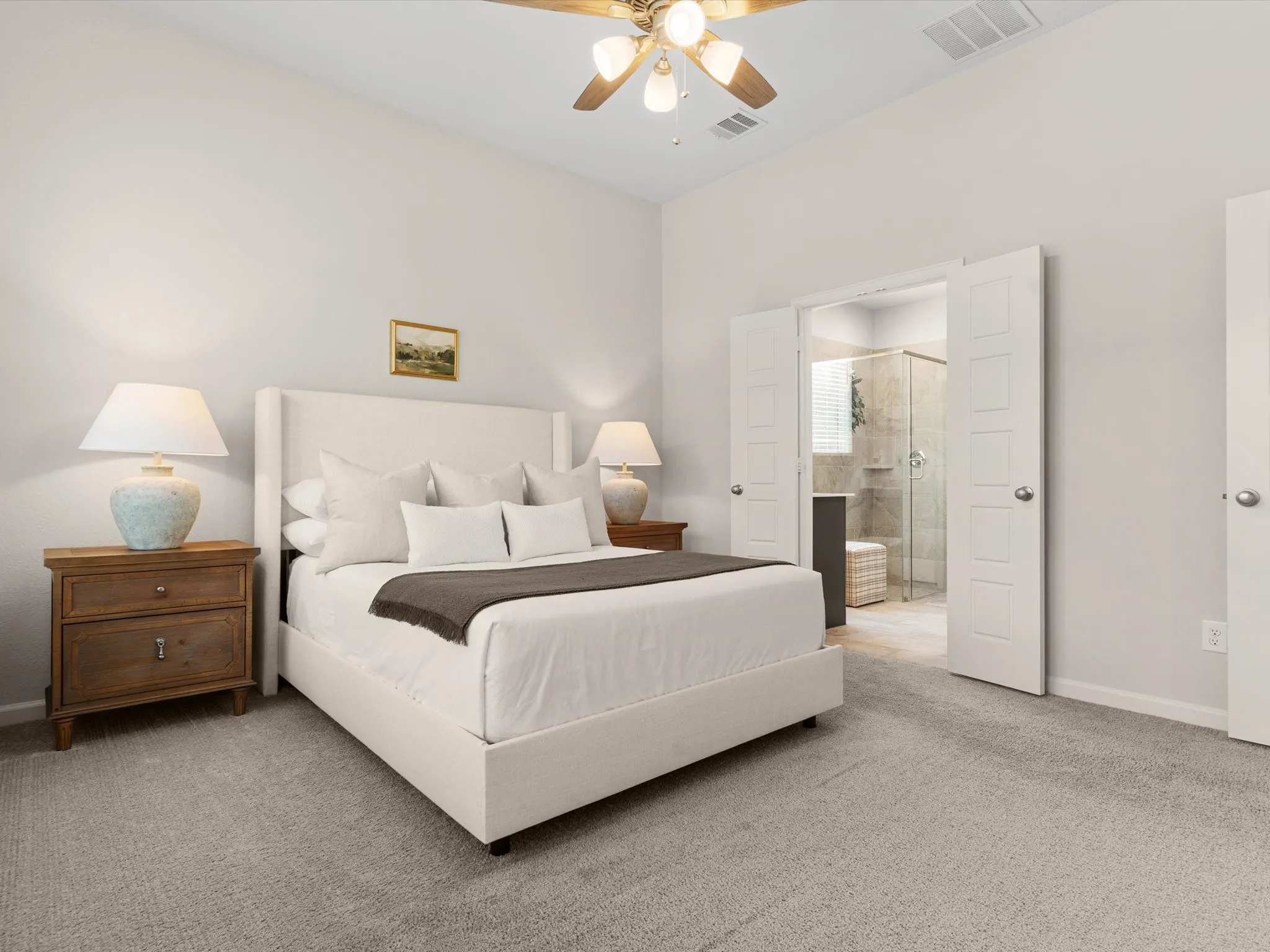 Private primary suite with spacious layout and large windows.