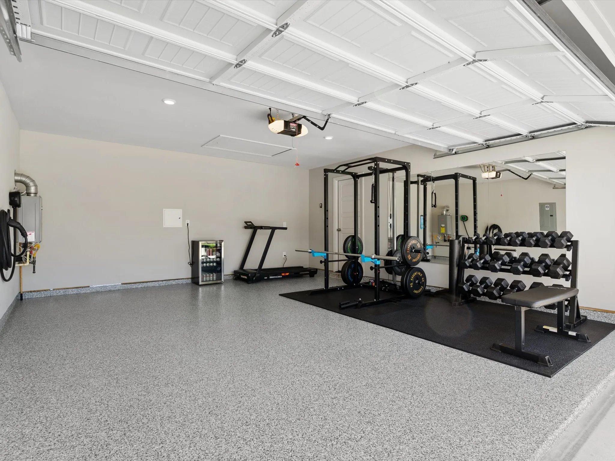 Upgraded garage with epoxy flooring. Ideal for a home gym