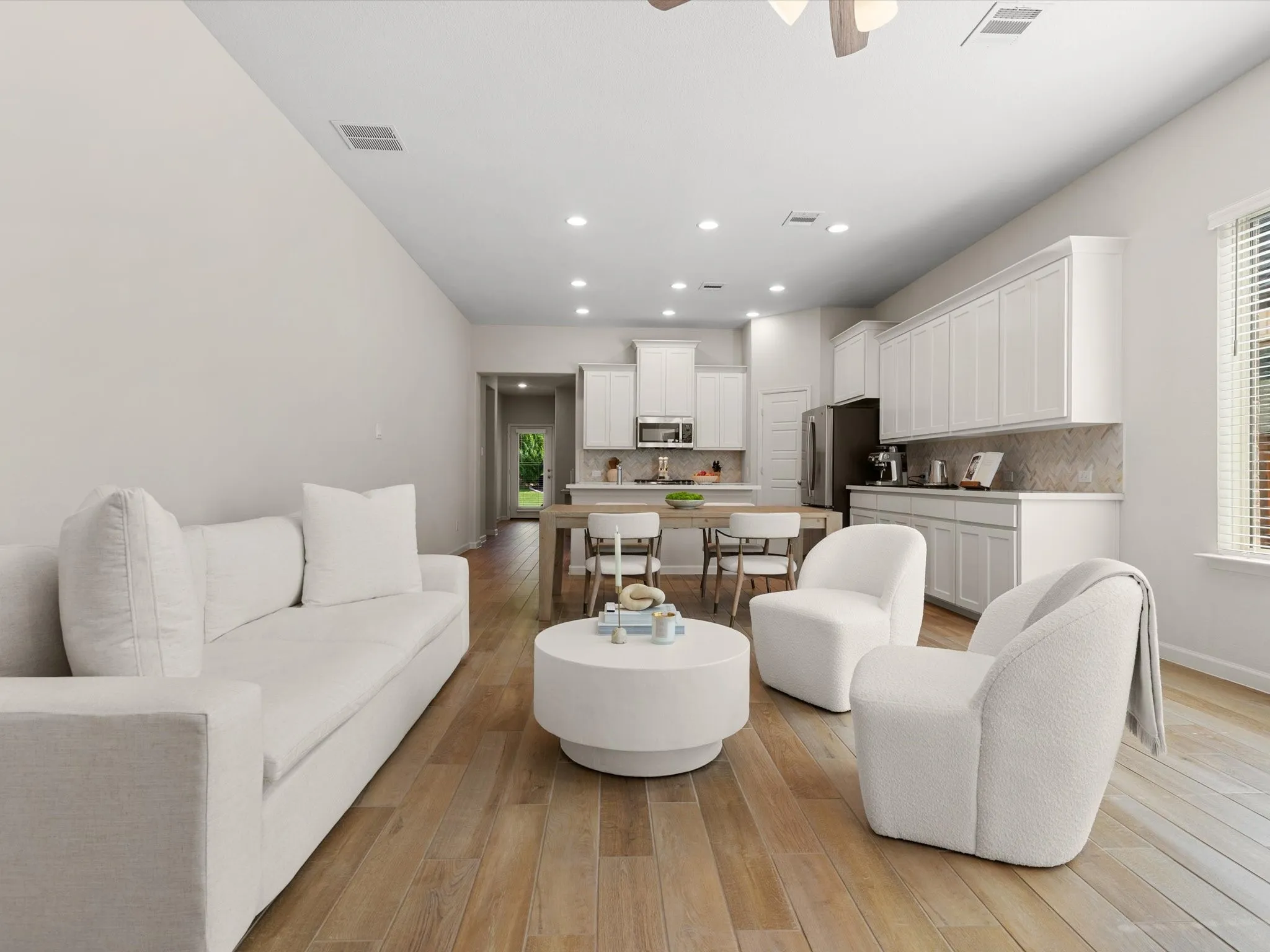 Spacious living room with abundant natural light and open-concept layout.
