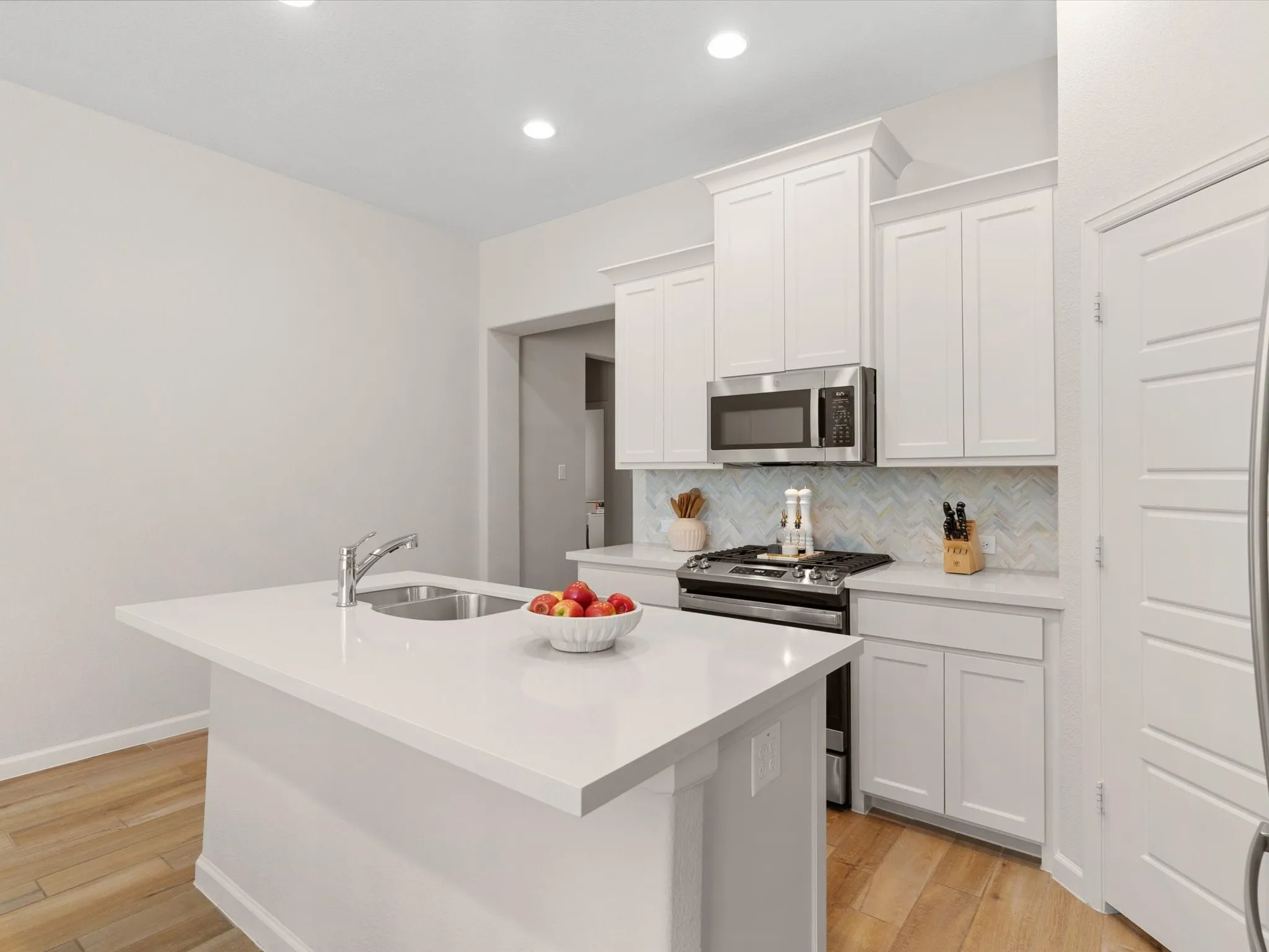 Kitchen with generous workspace, storage, and seamless flow to the main living areas.