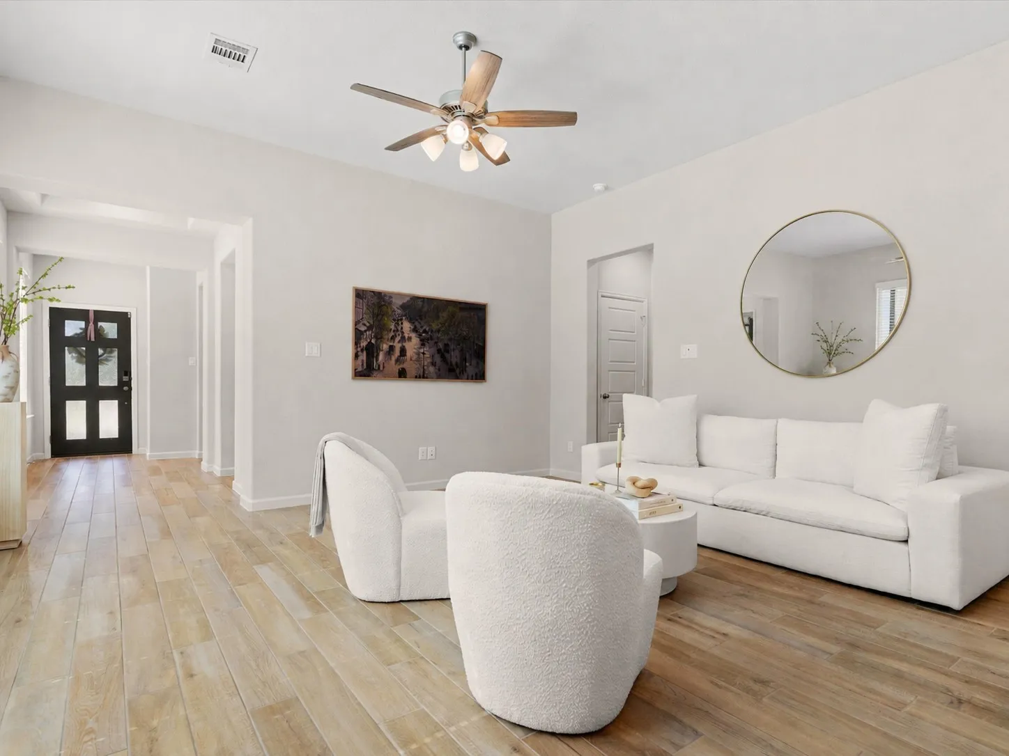 Spacious living room with abundant natural light and open-concept layout.