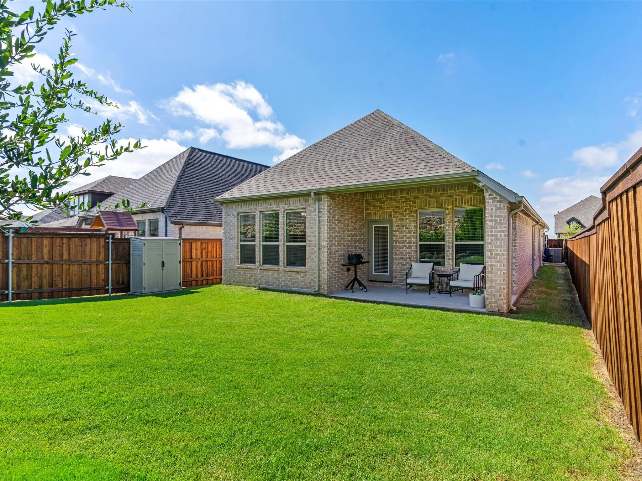 Fenced backyard with room for recreation, pets, or gardening.