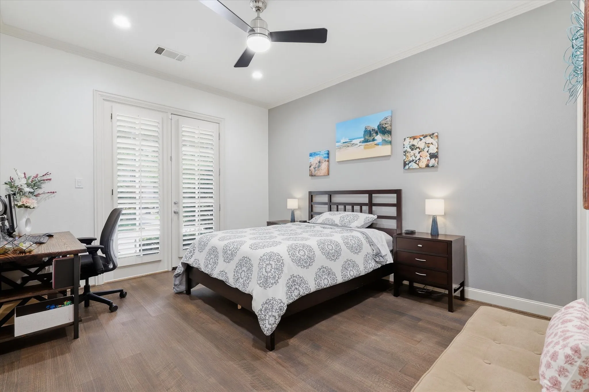 1st Floor Guest Suite with Bedroom featuring wood flooring, Plantation Shutters and an EnSuite​​‌​​​​‌​​‌‌​‌‌​​​‌‌​‌​‌​‌​​​‌​​ Bath.