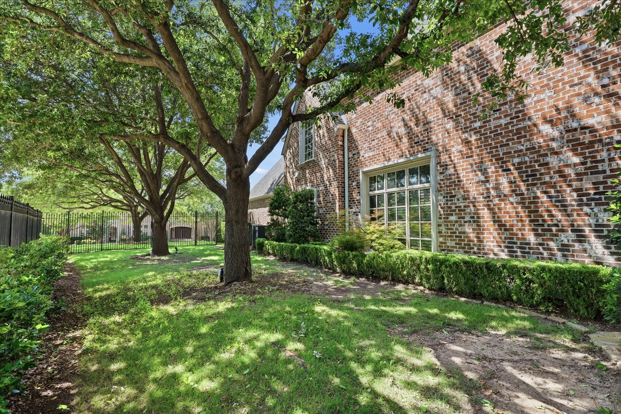 Shaded side yard is offers even more space for whatever you want.