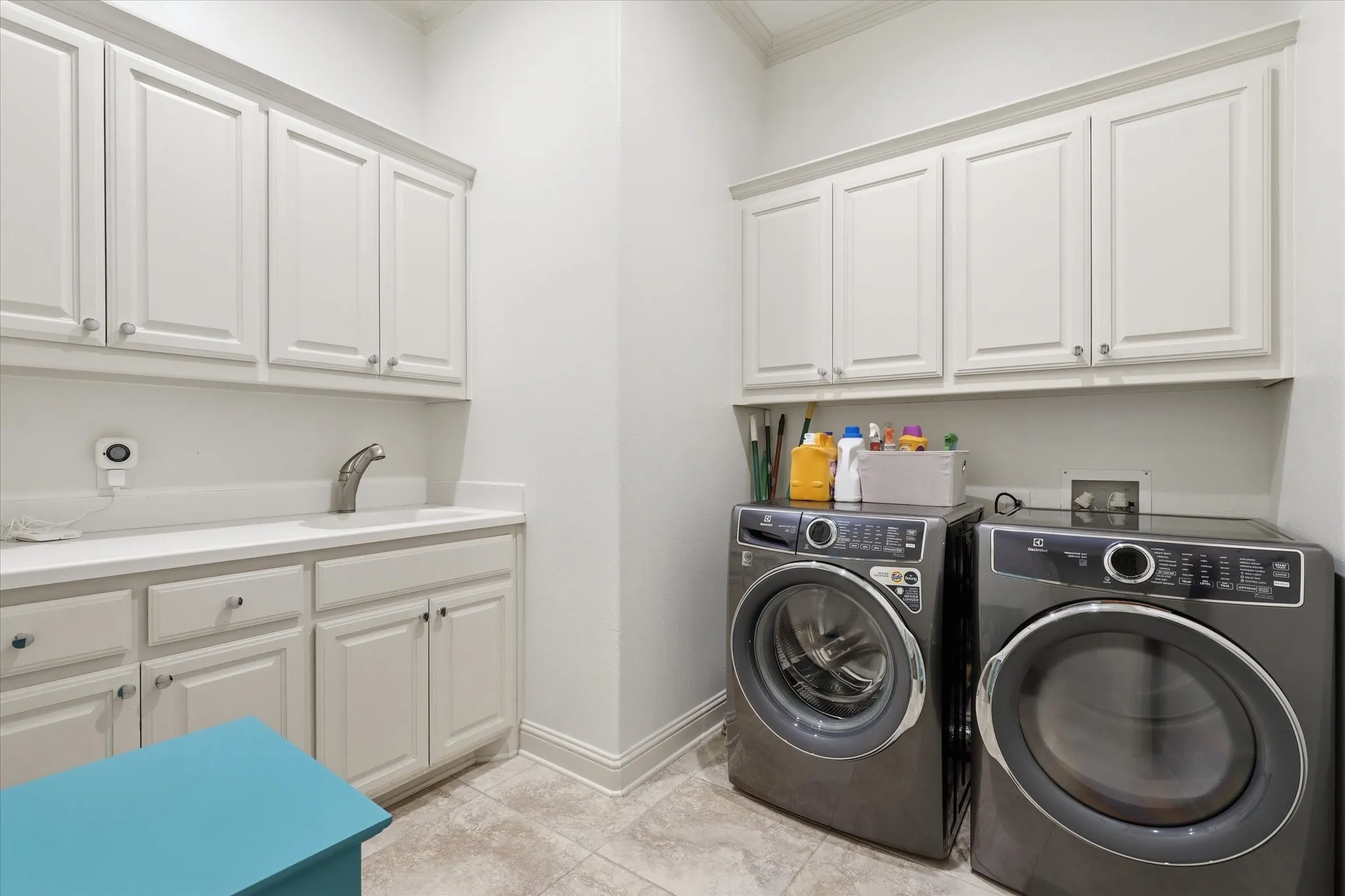 The Utility is nicely sized too with abundant cabinetry and a sink.