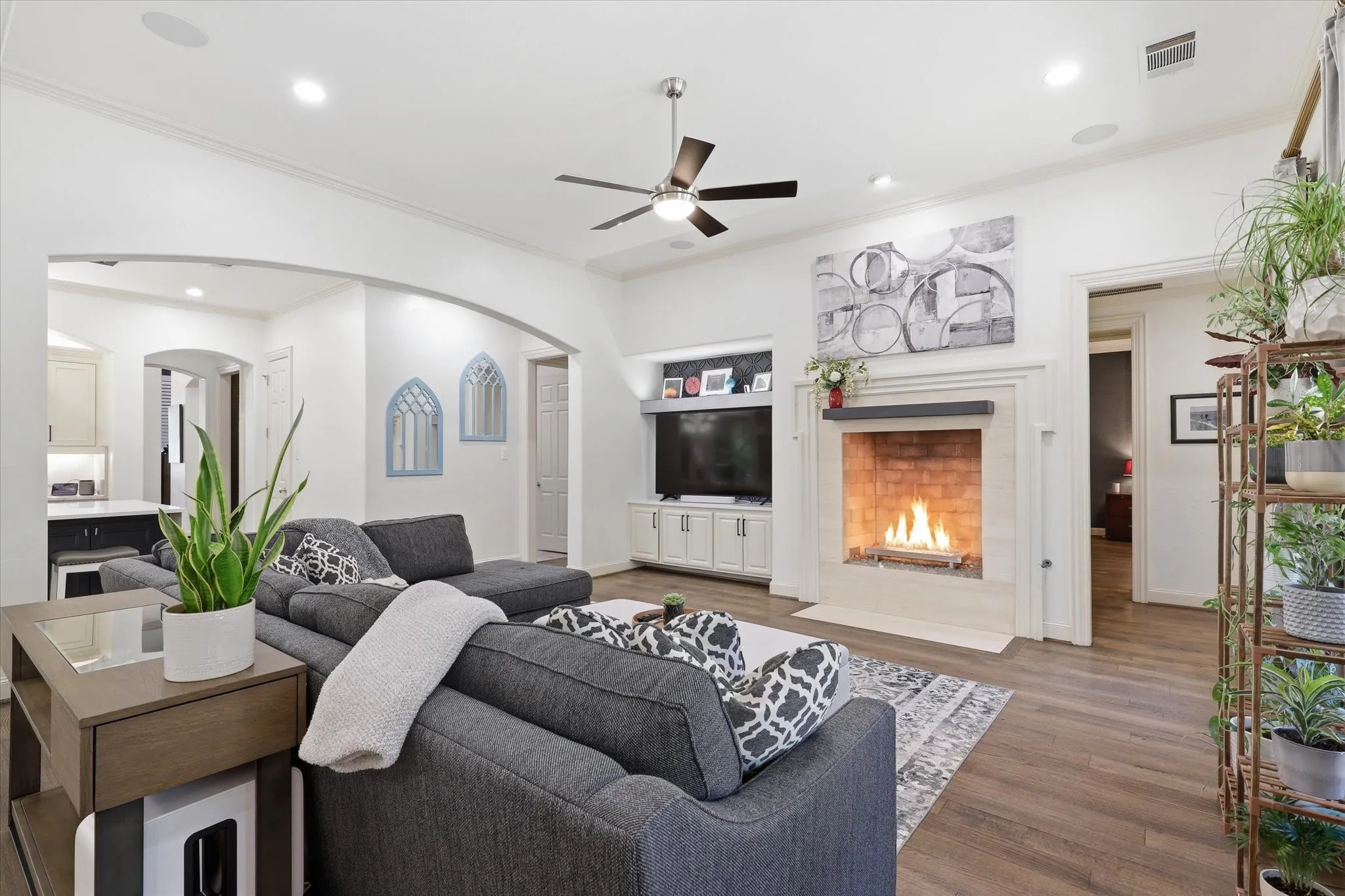 The Family Room offers updated built-ins, wood flooring and a warming fireplace.