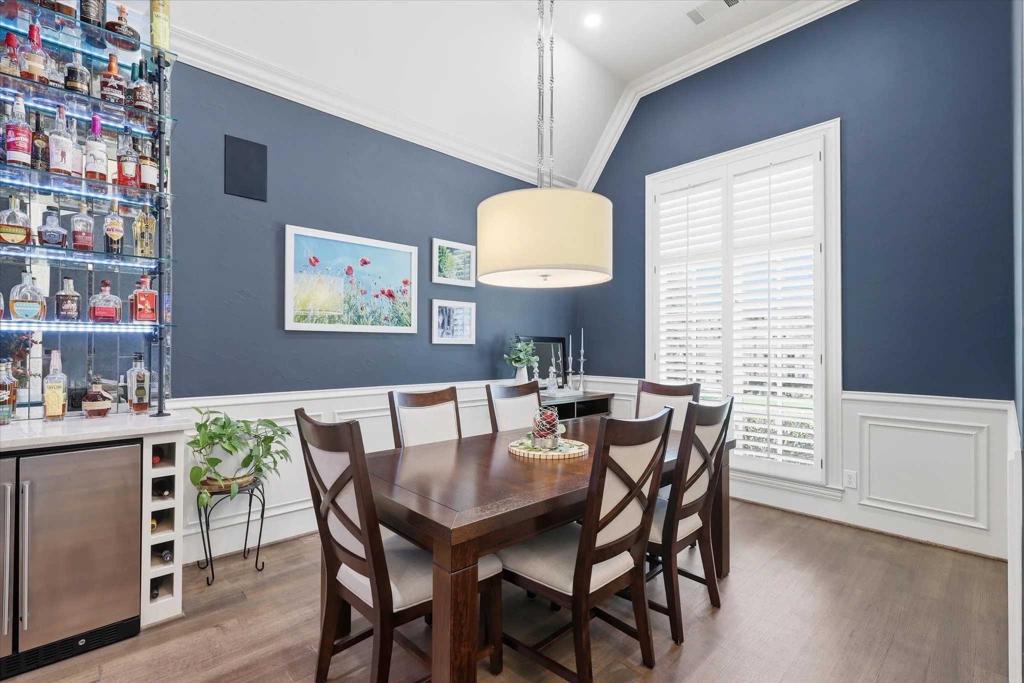 The formal Dining Room also offers wood flooring, wainscoting and a new wet bar!