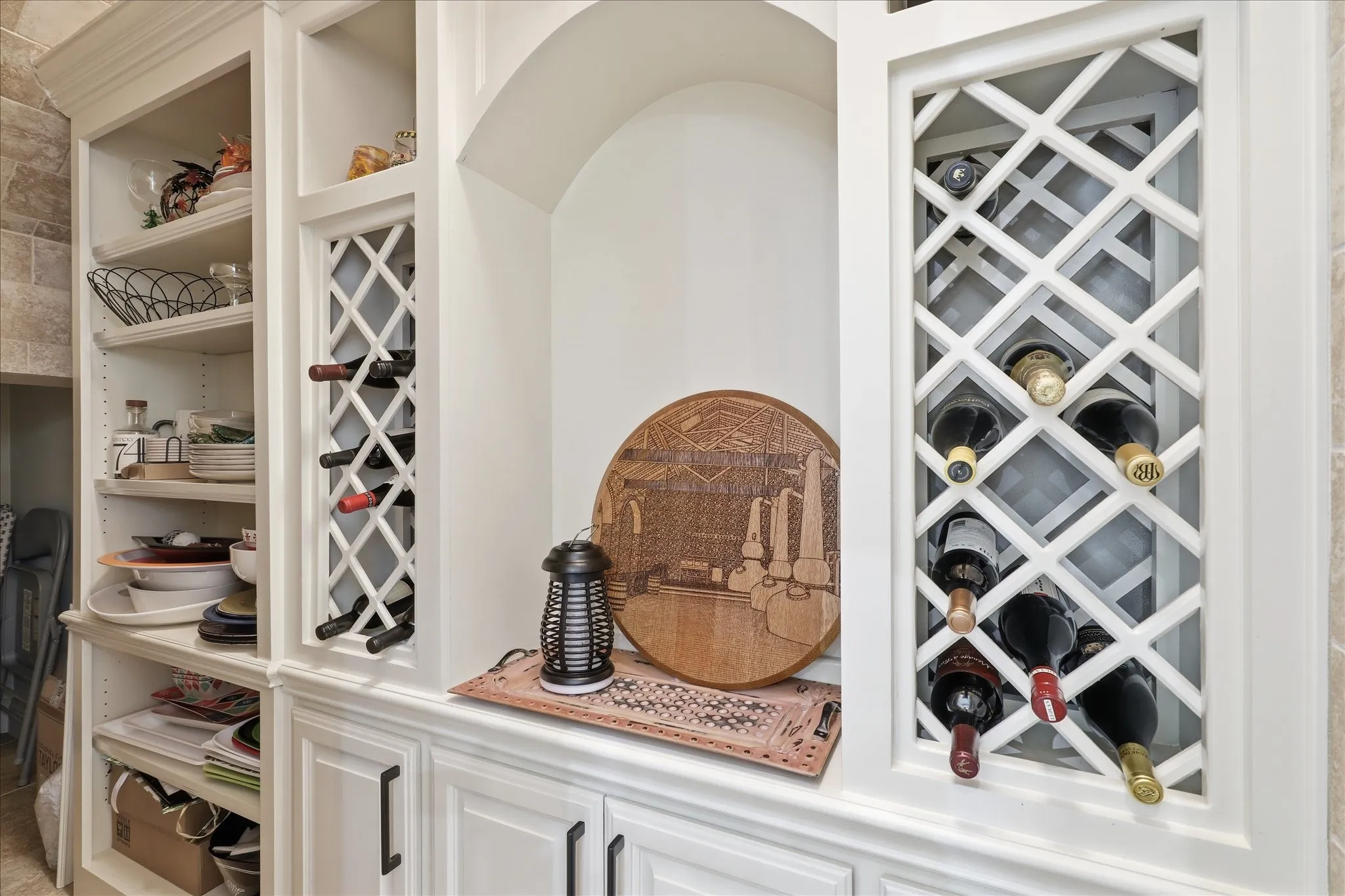 This large walk in storage area under the rear Stairway serves as a wine cellar, 2nd pantry and offers a huge amount of storage in the back.