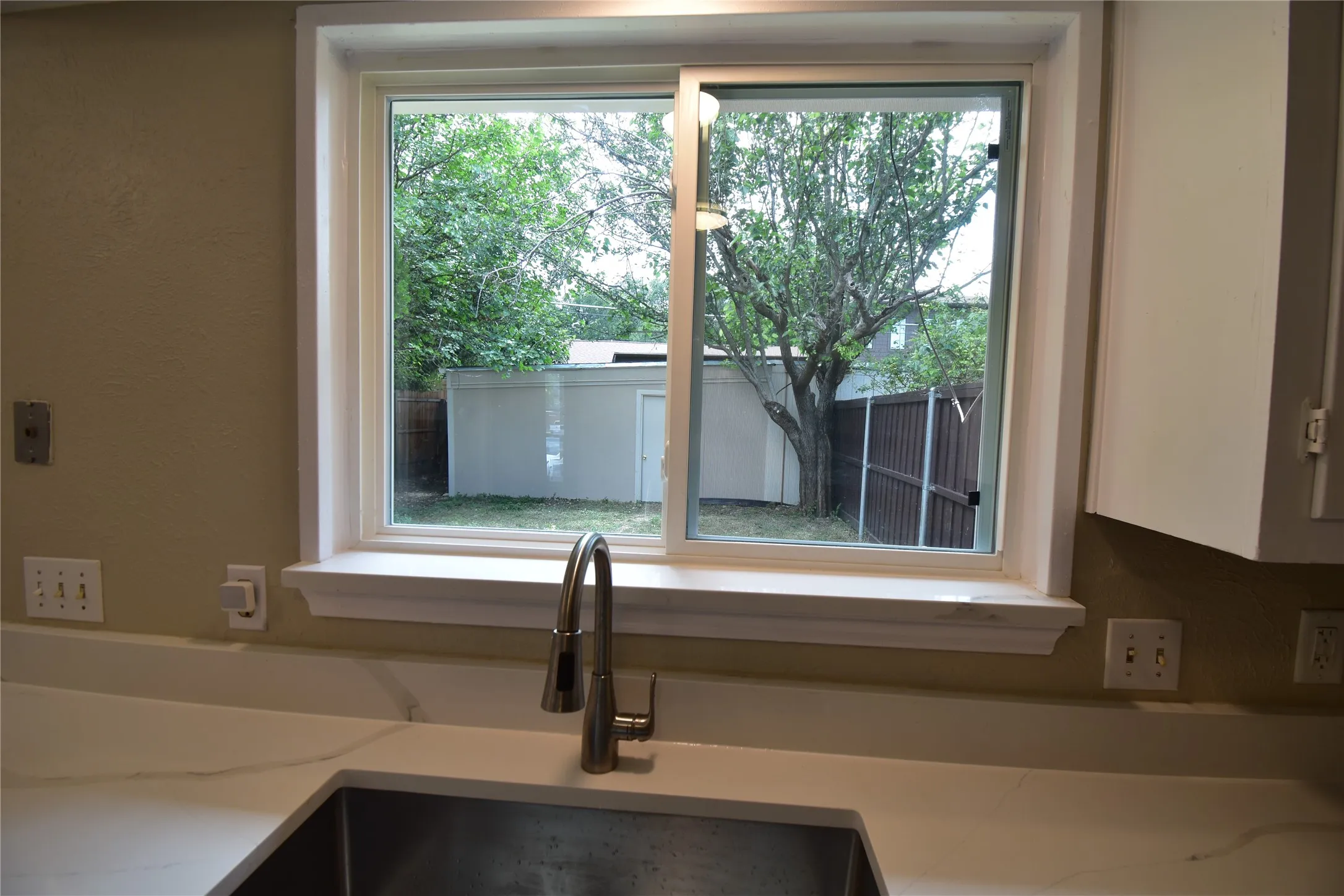 Over look the courtyard and garage from kitchen