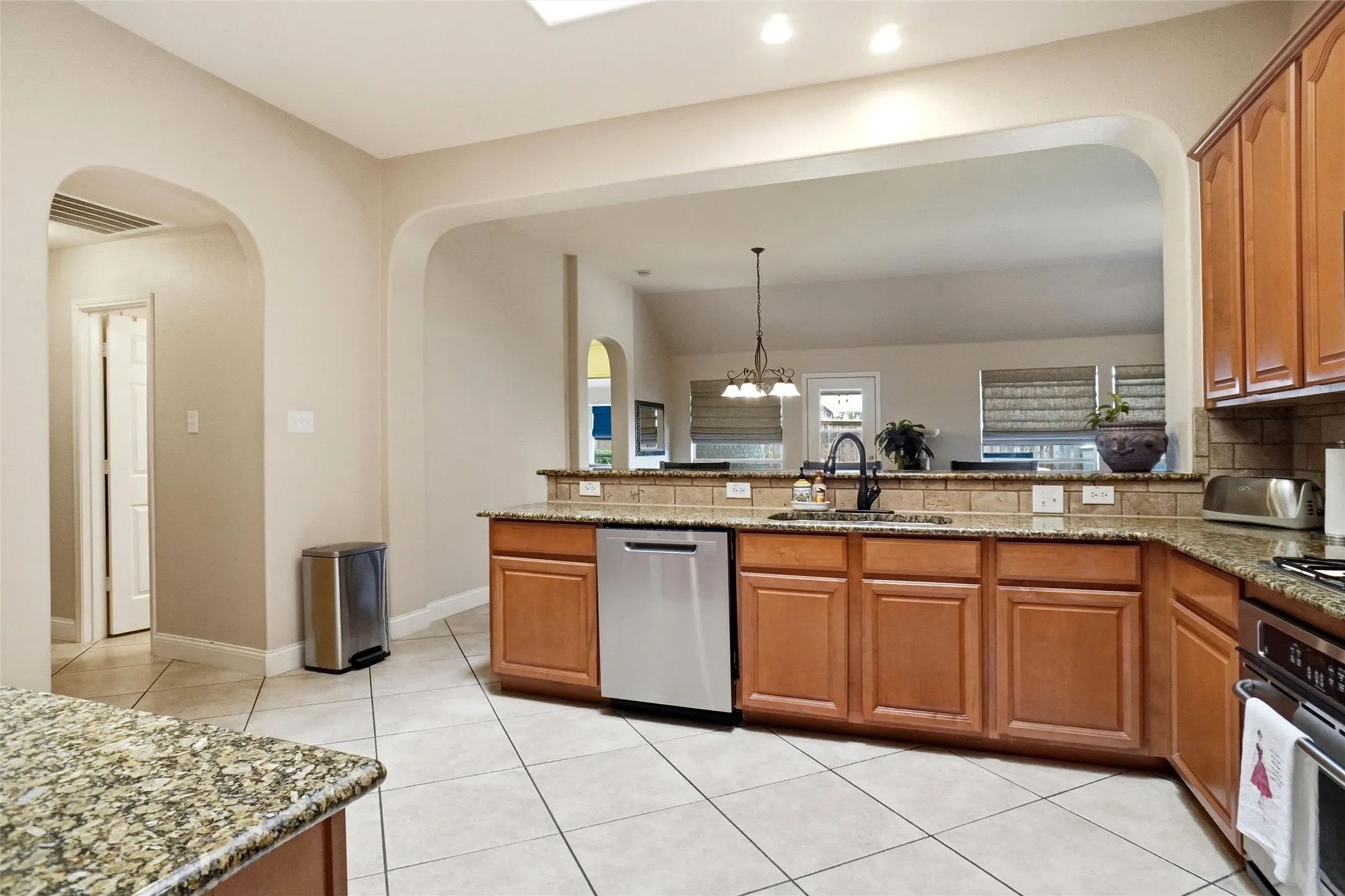 Kitchen featuring light wood cabinetry and granite countertops