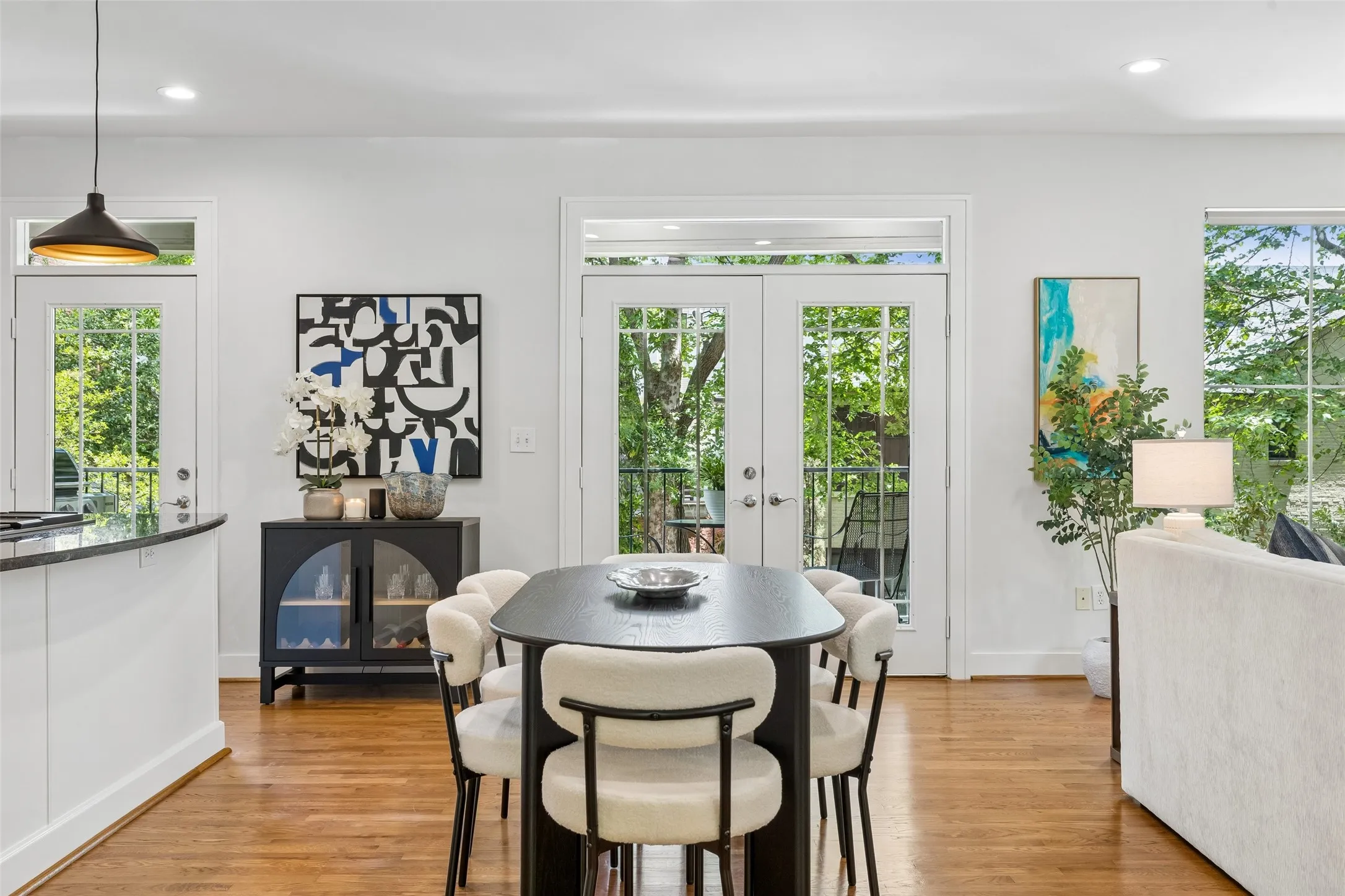 Open-concept dining area featuring hardwood flooring
