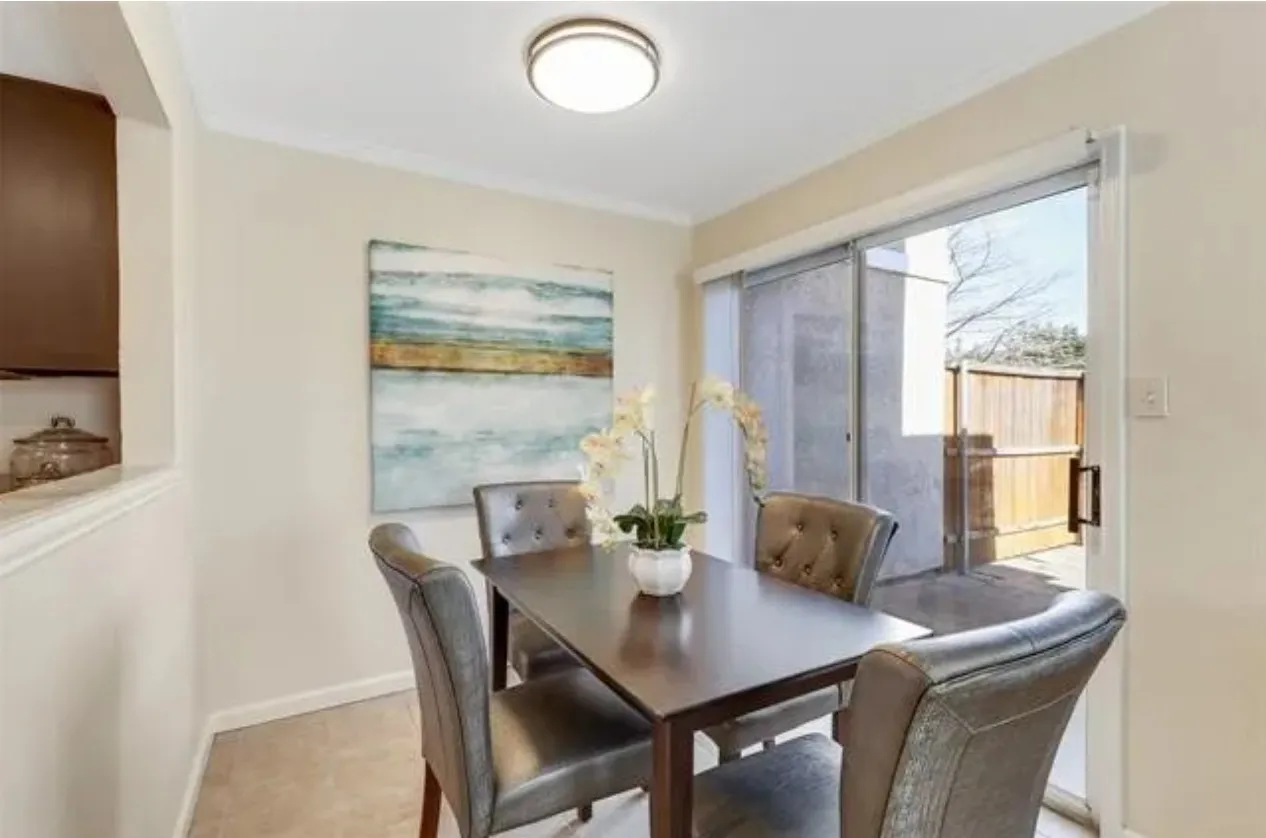 Dining area with neutral wall paint, white crown molding, and recessed lighting