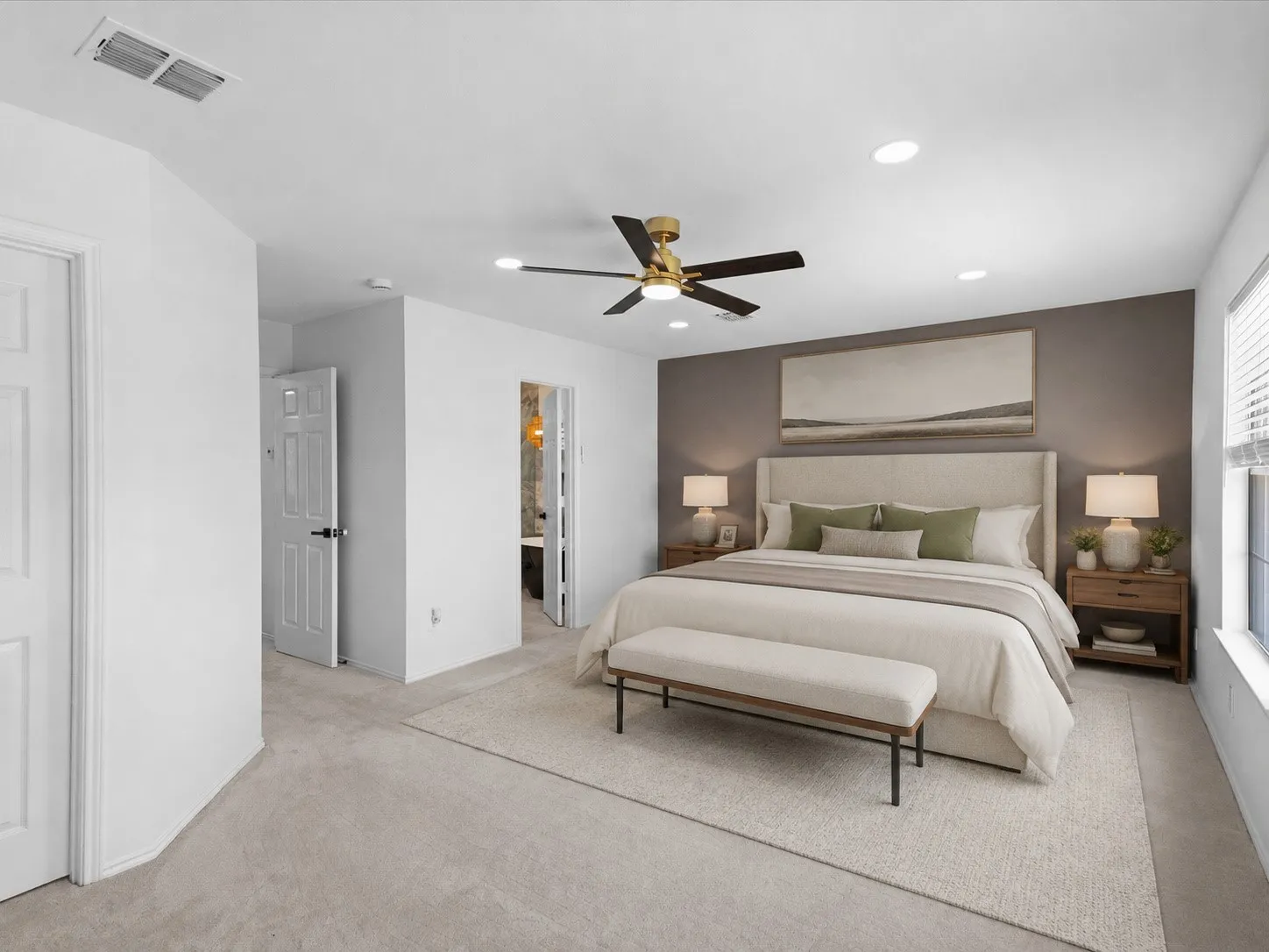 Recessed ceiling lighting, a contemporary ceiling fan, and a neutral color palette