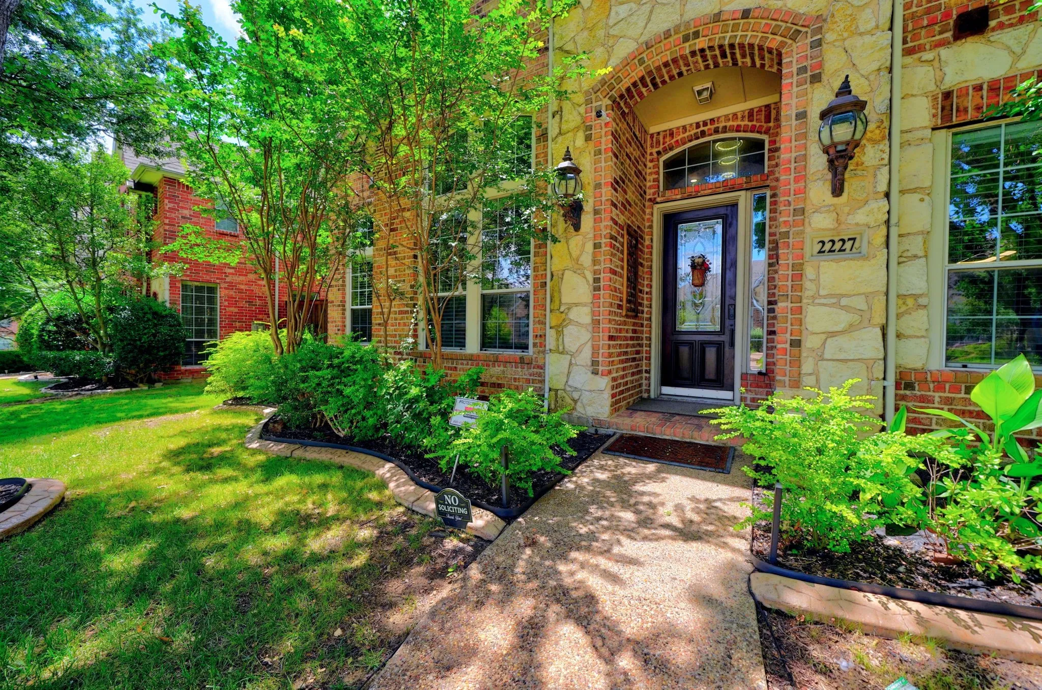 Stone and brick facade with an arched entryway