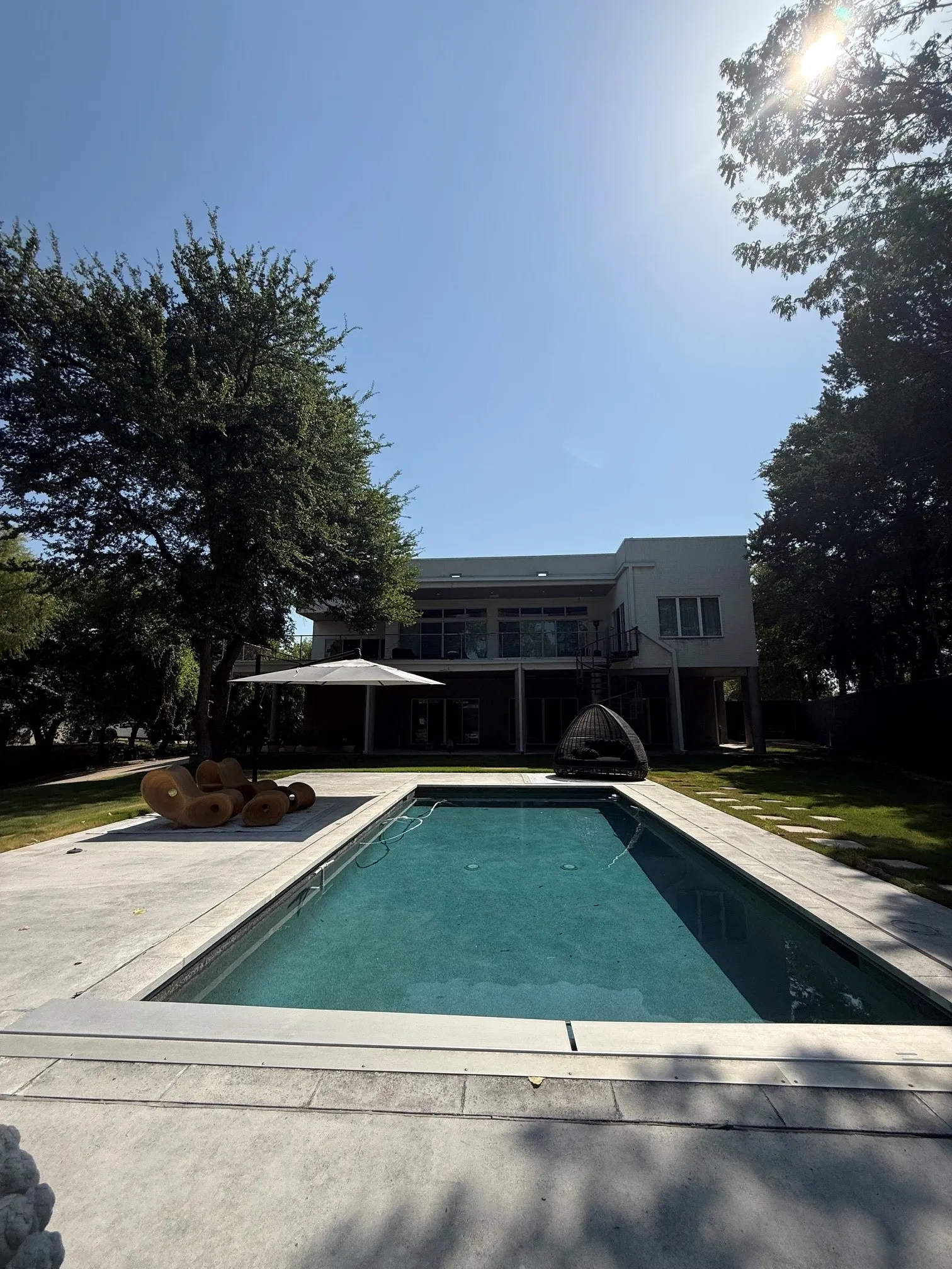 Rectangular inground pool with concrete surround