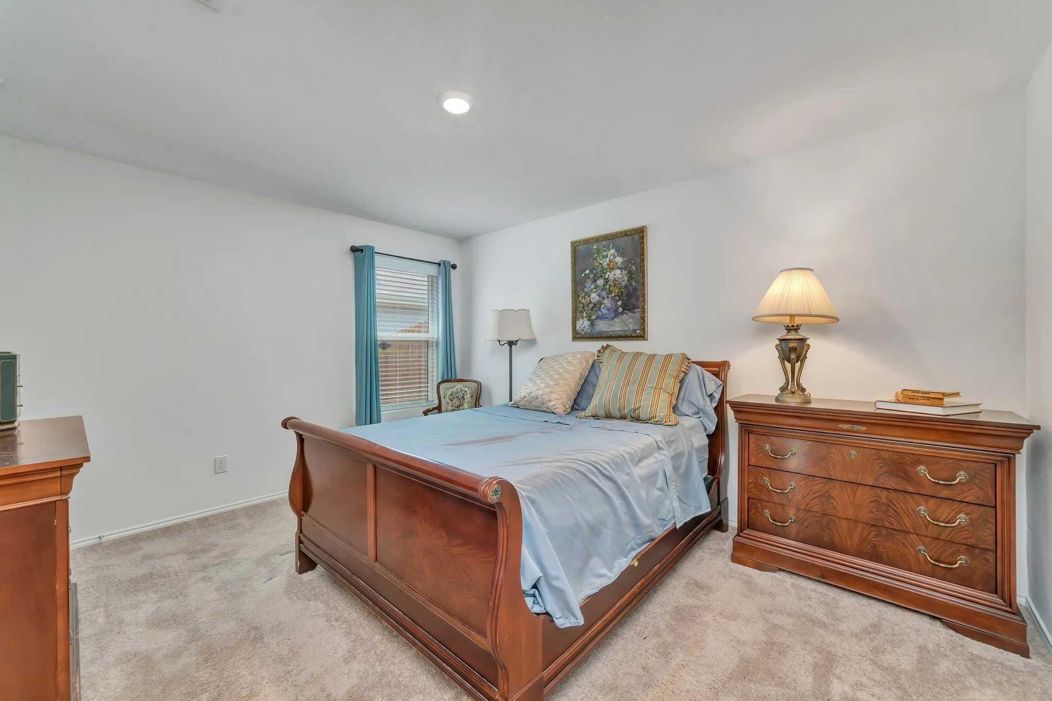 Carpeted room featuring a window with blinds, recessed lighting, and white walls