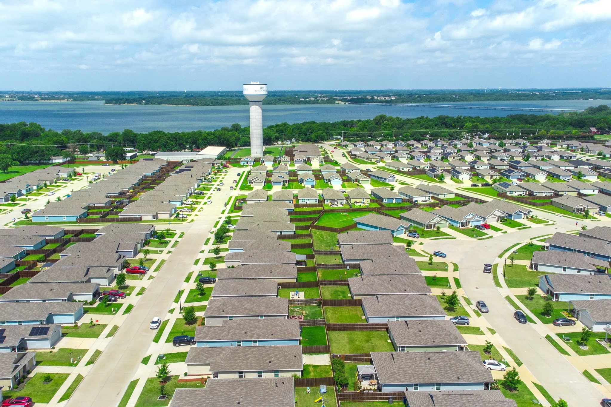 Aerial perspective showcasing a residential community with numerous single-story homes