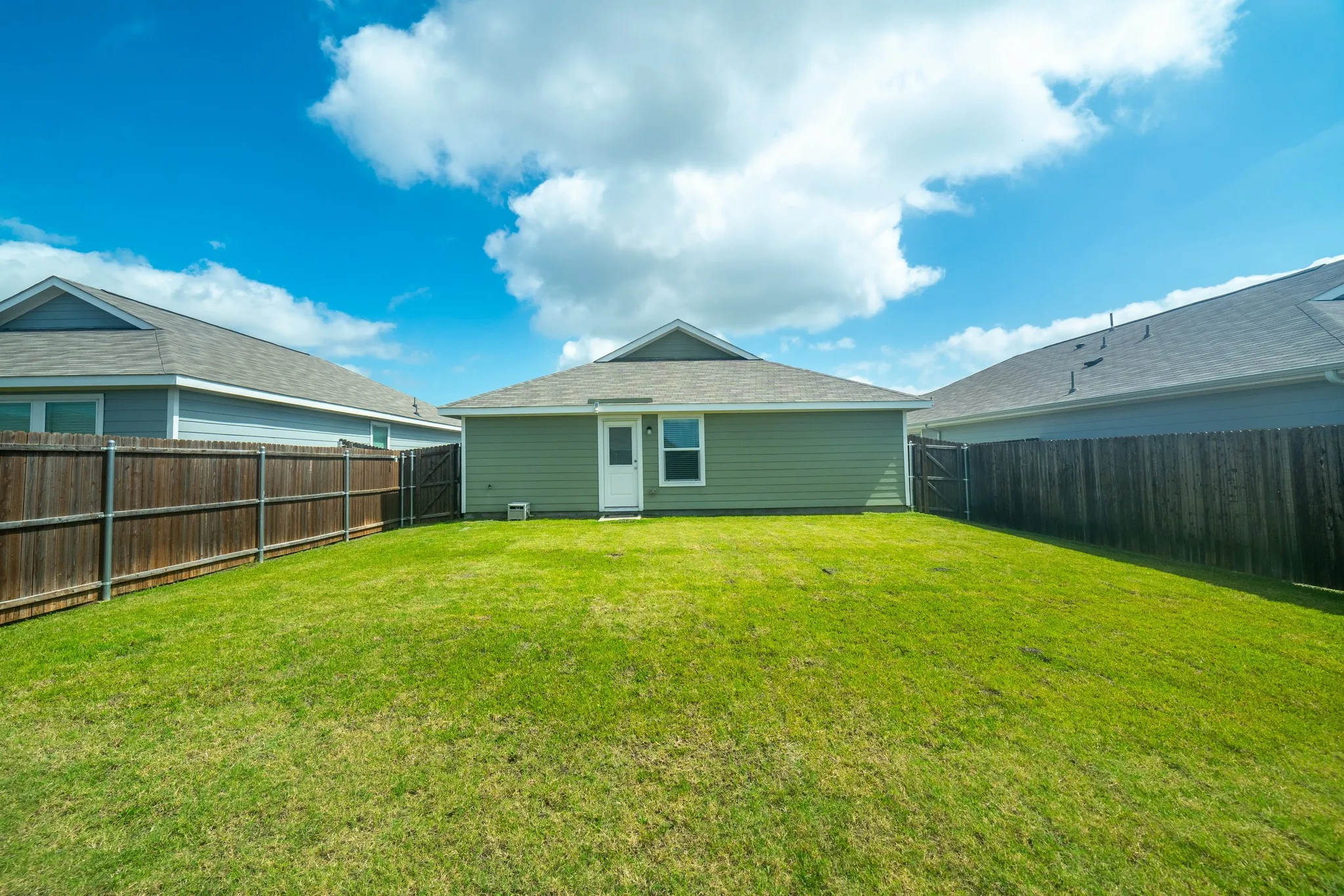 Expansive green lawn providing ample outdoor space