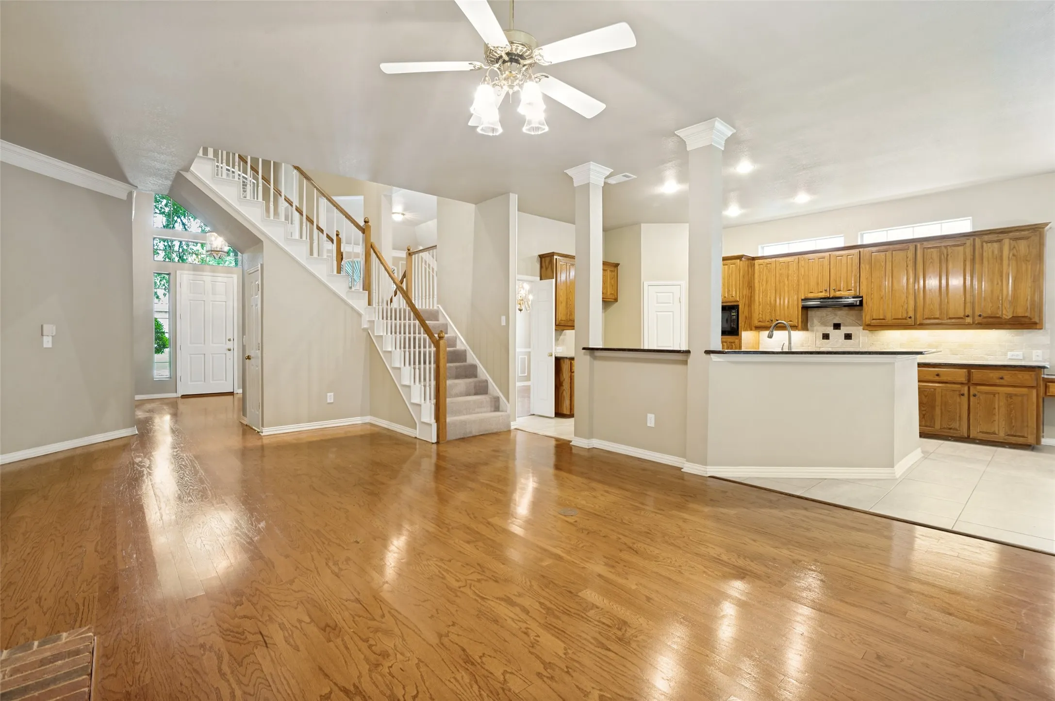 The open concept includes the foyer that leads into the family room and kitchen with a breakfast dining area.