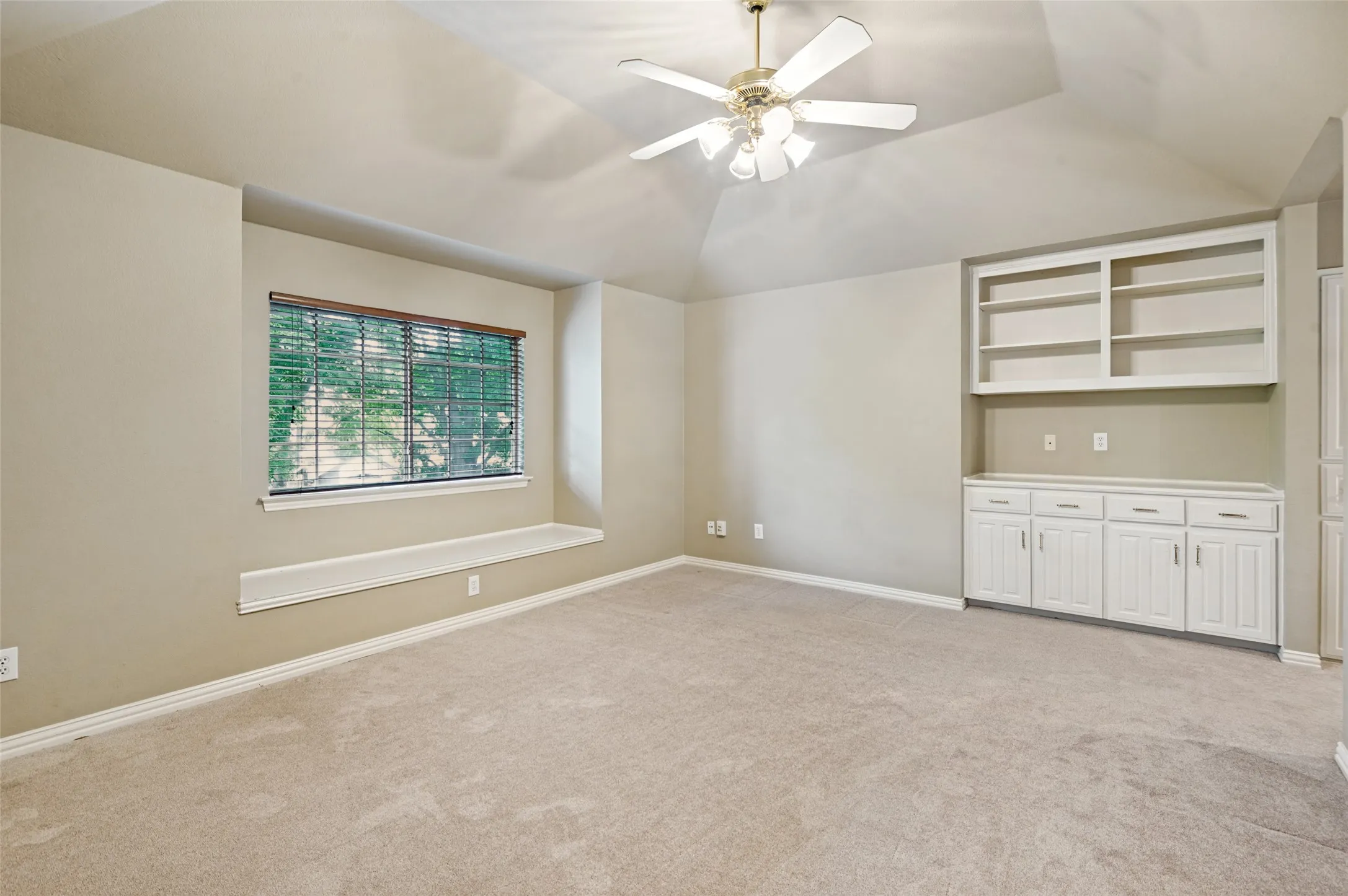 Great living space upstairs with built in cabinets and bookshelves. Window seats in many rooms and ceiling fans throughout the home