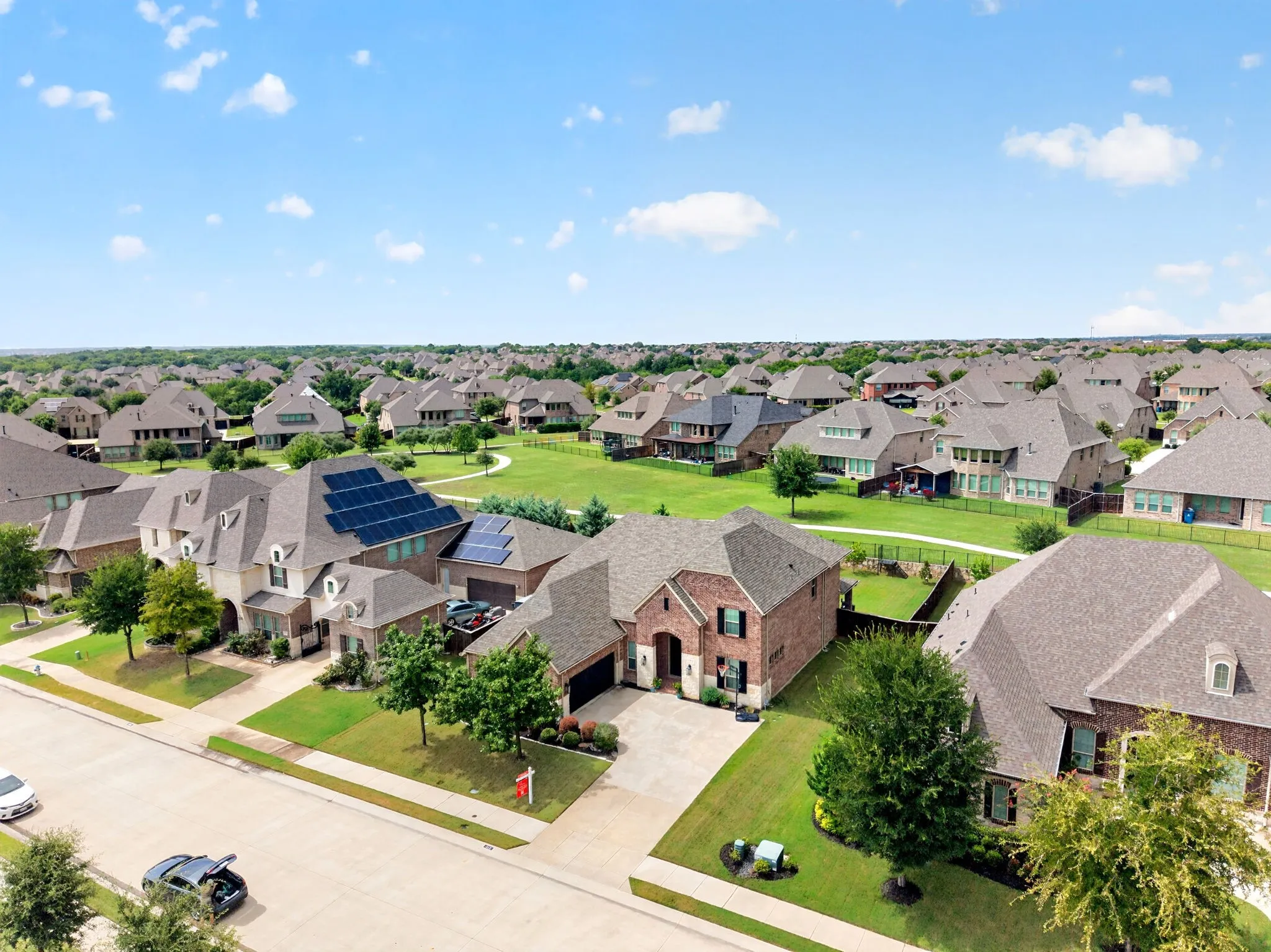 Expansive residential community featuring mature landscaping and a variety of architectural styles