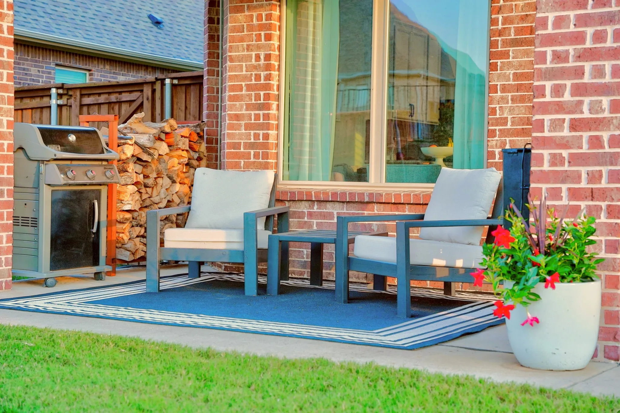 Brick exterior patio area with concrete flooring