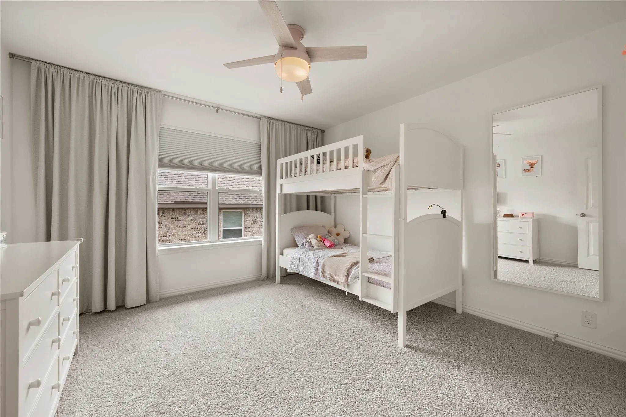 Bedroom #3 features a ceiling fan and plush carpet
