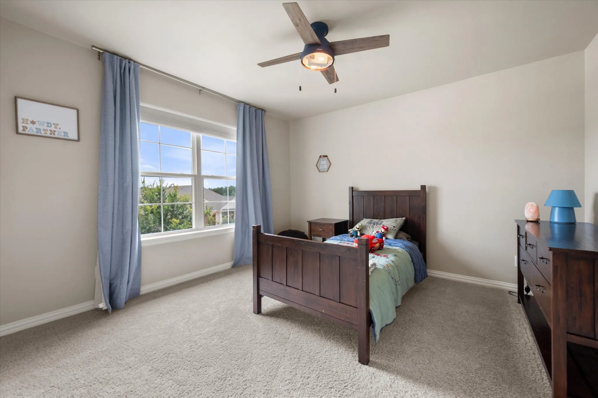 Bedroom #2 features ceiling fan and plush carpet.