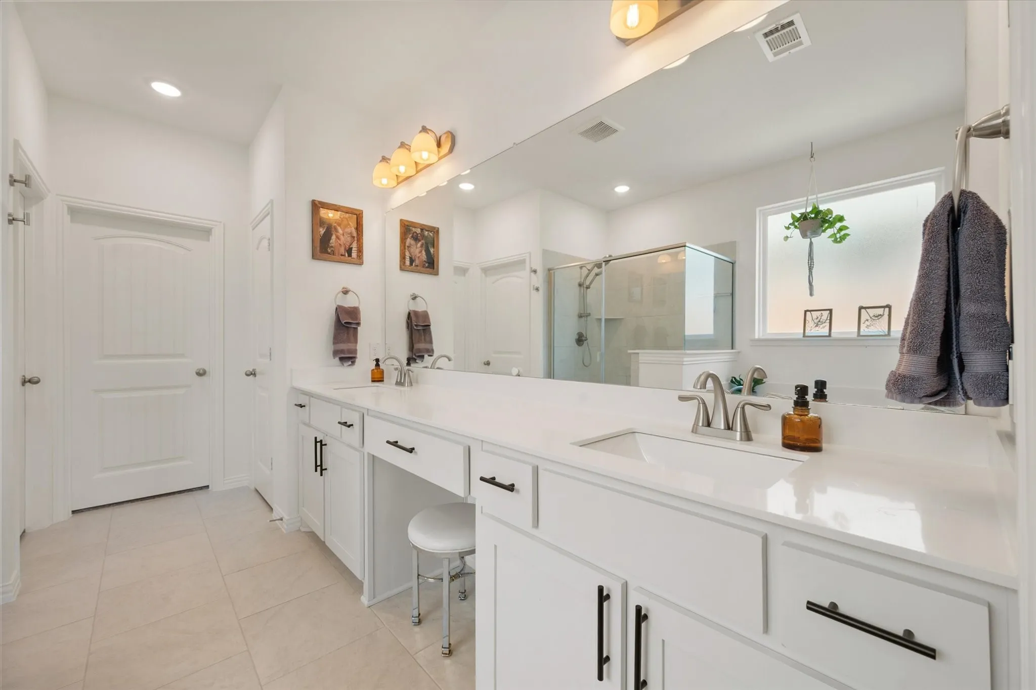 Primary bathroom features dual sinks.