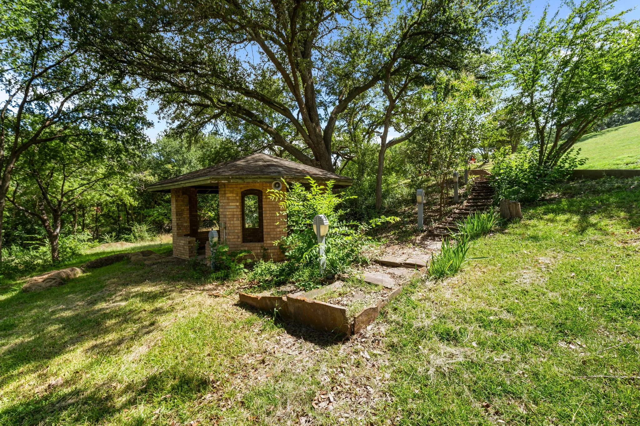 Separate covered patio next to pond