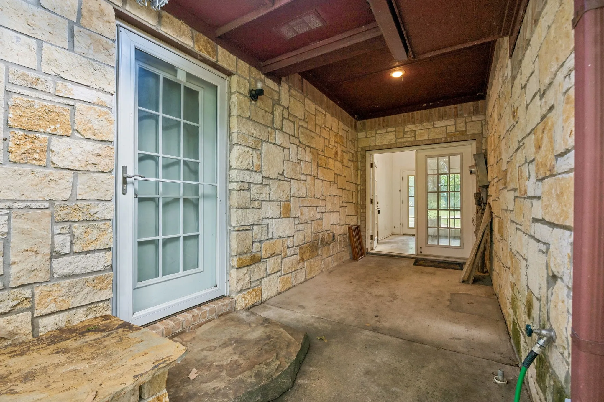 Breezeway between main home, garage, and studio apartment