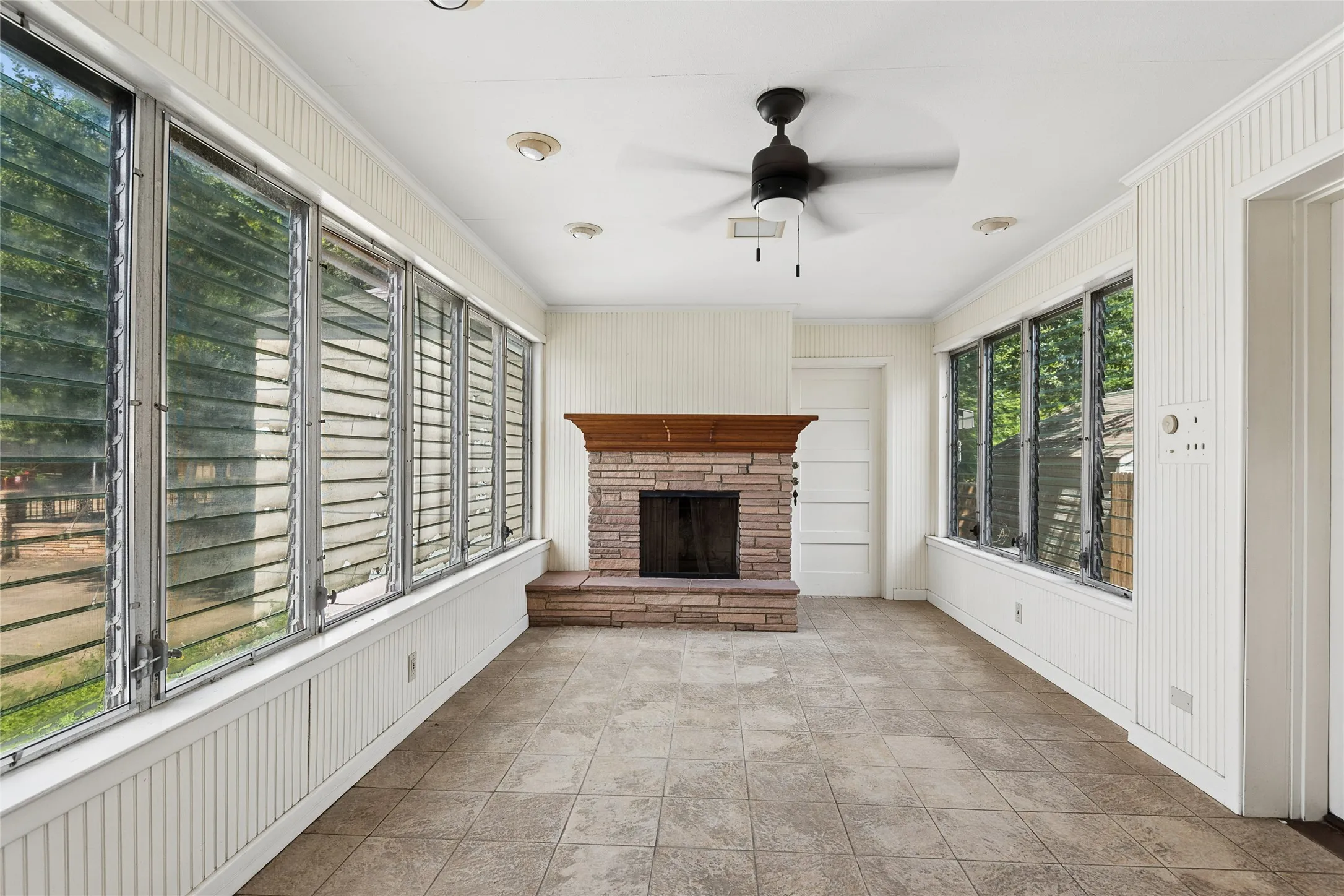 Sunroom with fireplace