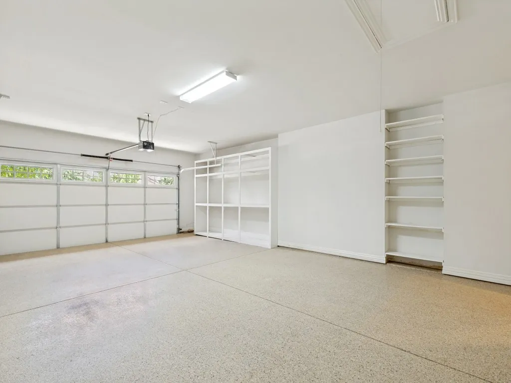 2.5 Car Oversized Epoxy Coated Garage with built in Storage and Attic Storage.